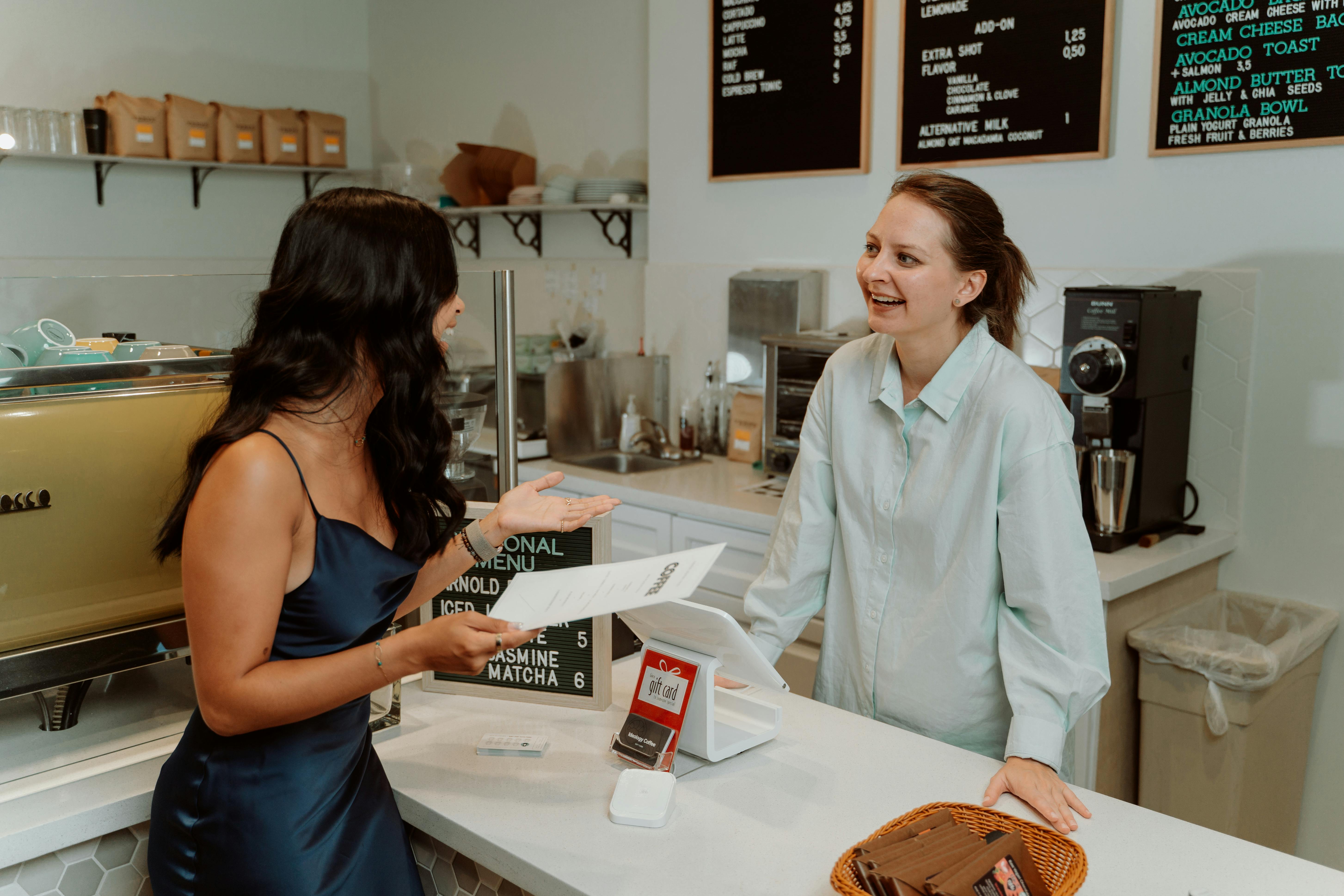 A cashier interacting with a customer | Source: Pexels