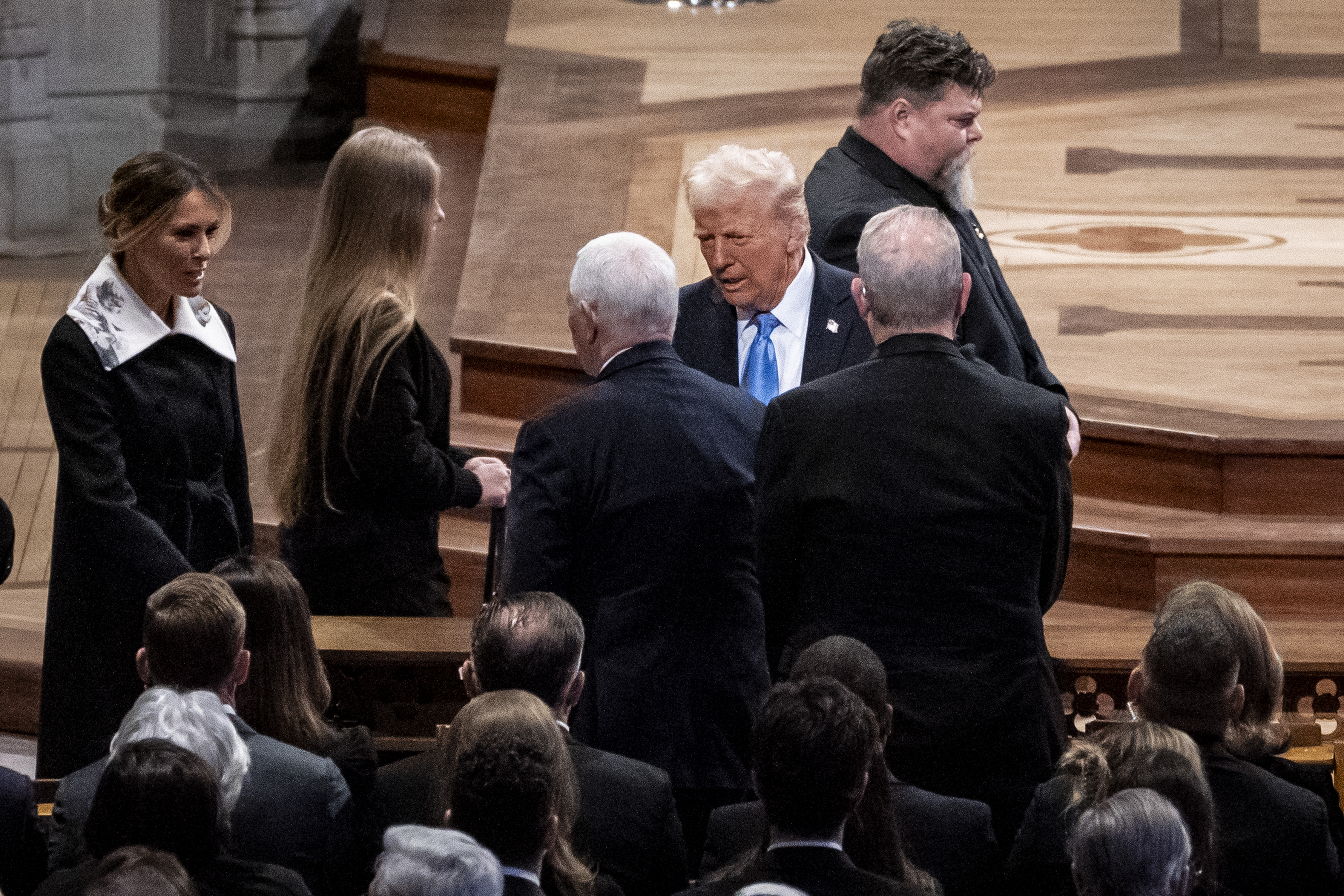 President-elect Donald Trump and incoming first lady Melania Trump greet former Vice President Mike Pence at the state funeral for former President Jimmy Carter on January 9, 2025, in Washington, D.C. | Source: Getty Images