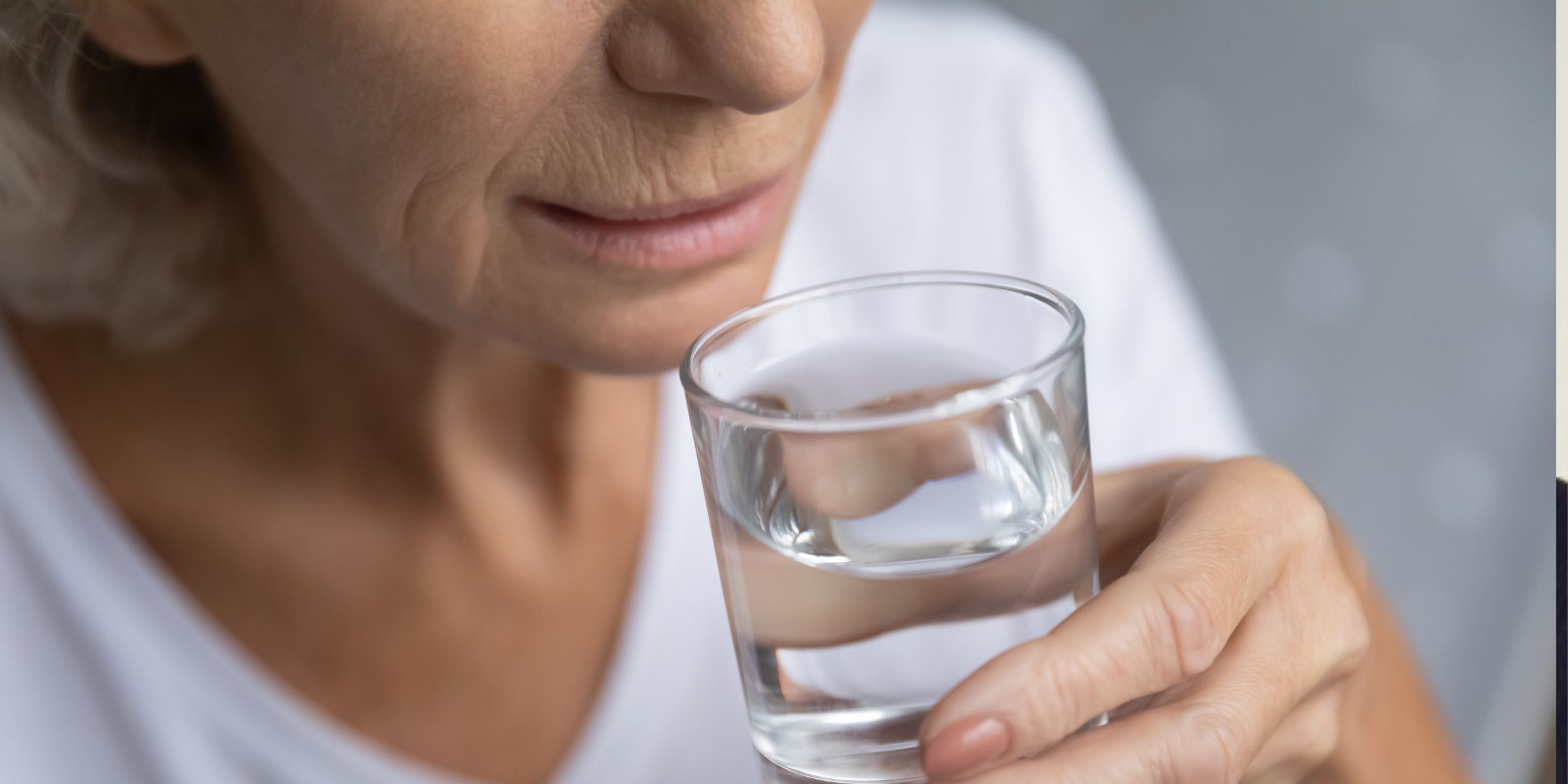 Woman with a glass of water | Source: Shutterstock
