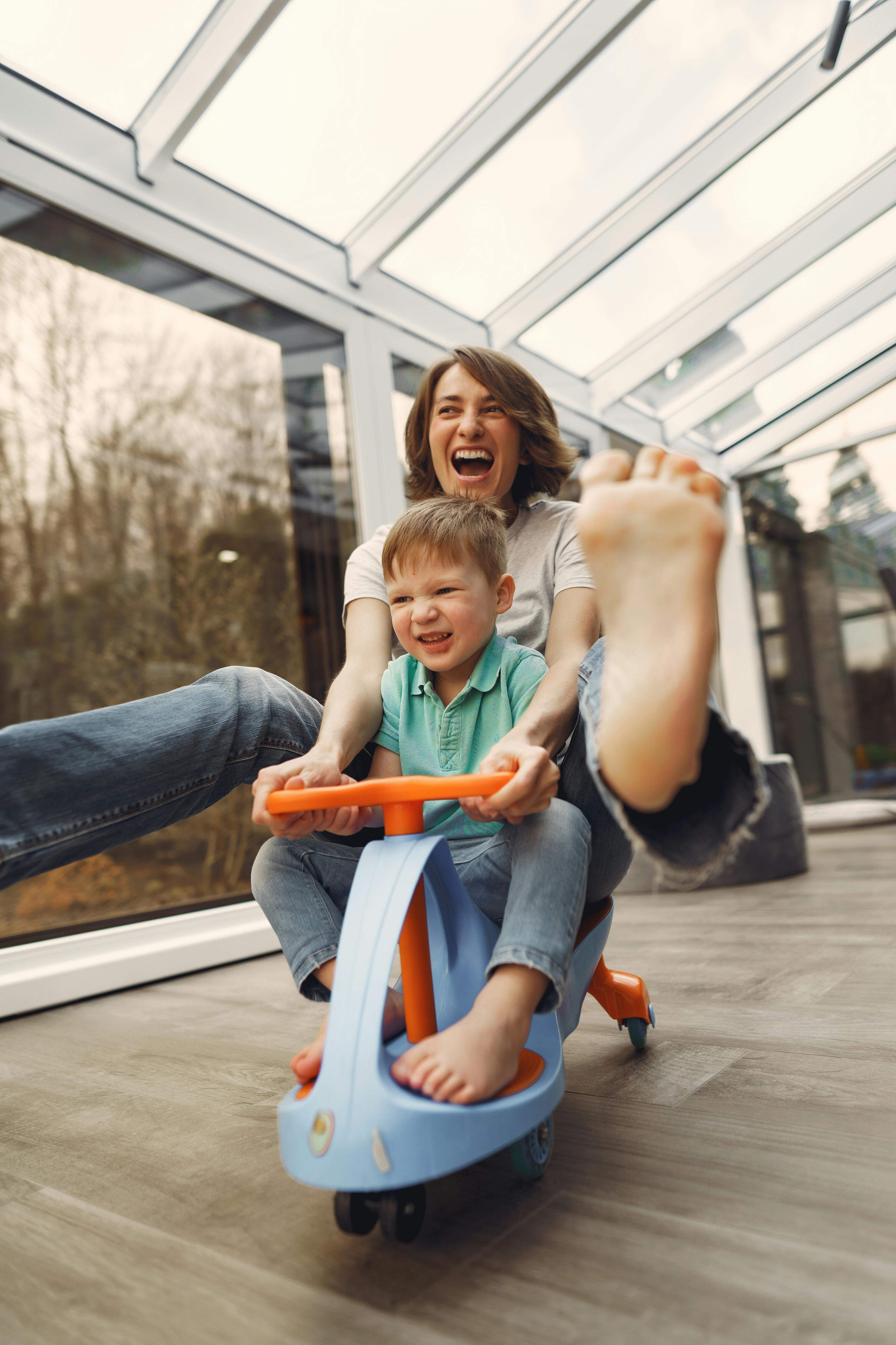 A happy woman playing with her son | Source: Pexels
