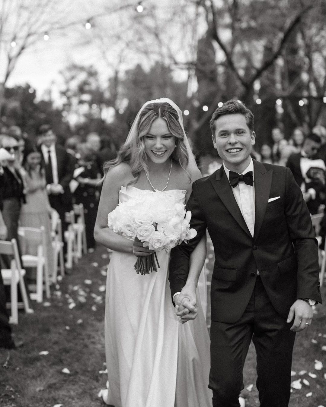 Lev Bure and his bride Elliot during their wedding ceremony, dated January 2024 | Source: Instagram/candacecbure