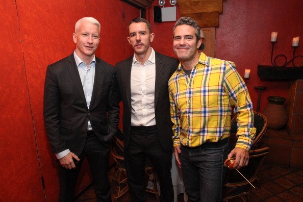 Anderson Cooper, Benjamin Maisani and Andy Cohen at Trattoria Dell Arte Restaurant on November 8, 2013 in New York City. | Photo: Getty Images