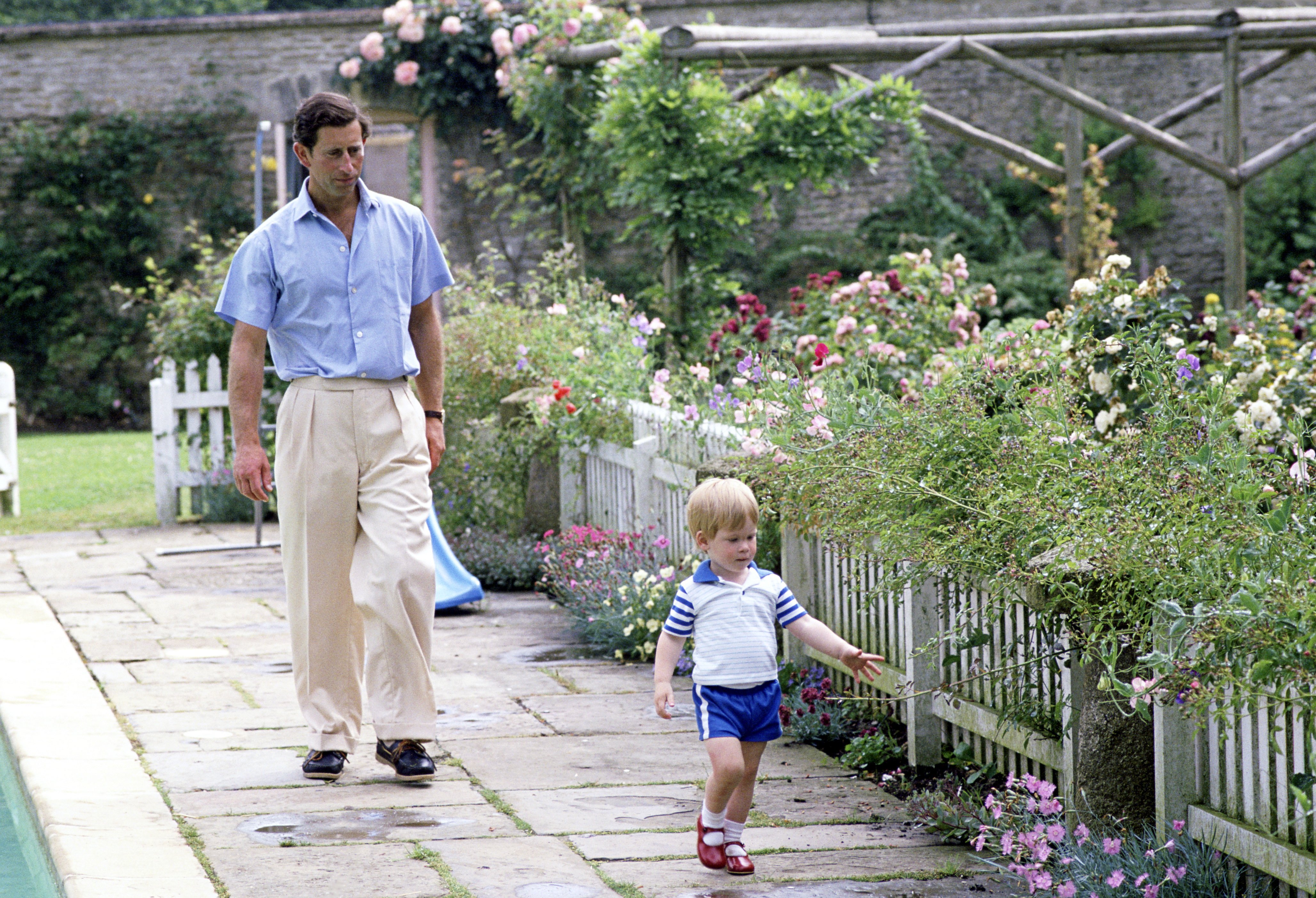 King Charles And Prince Harry By The Swimming Pool In The Garden At Their Home Highgrove House, Circa 1986 | Source: Getty Images