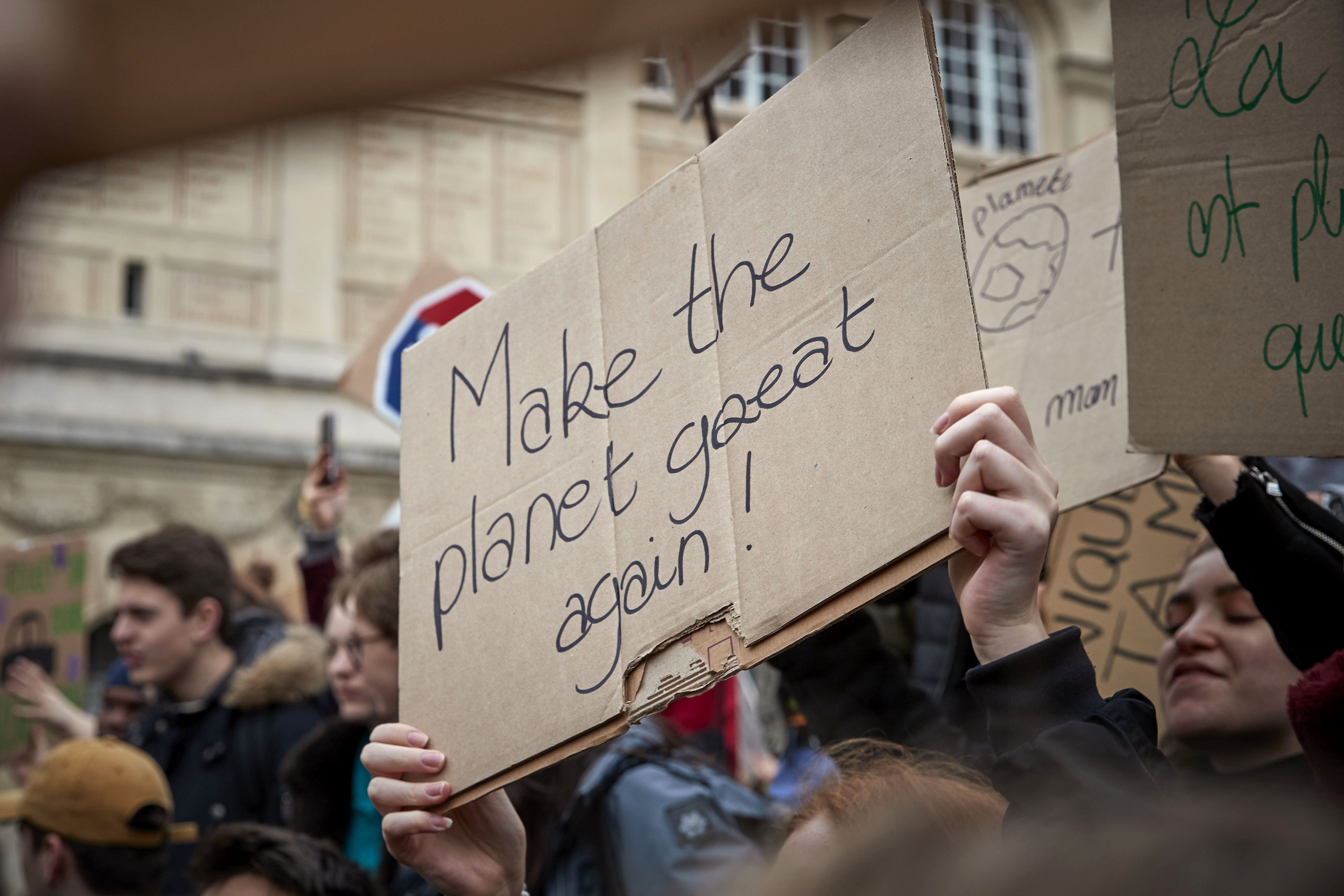 A placard being held during the Fridays for Future against climate change in Paris, France | Photo: Getty Images