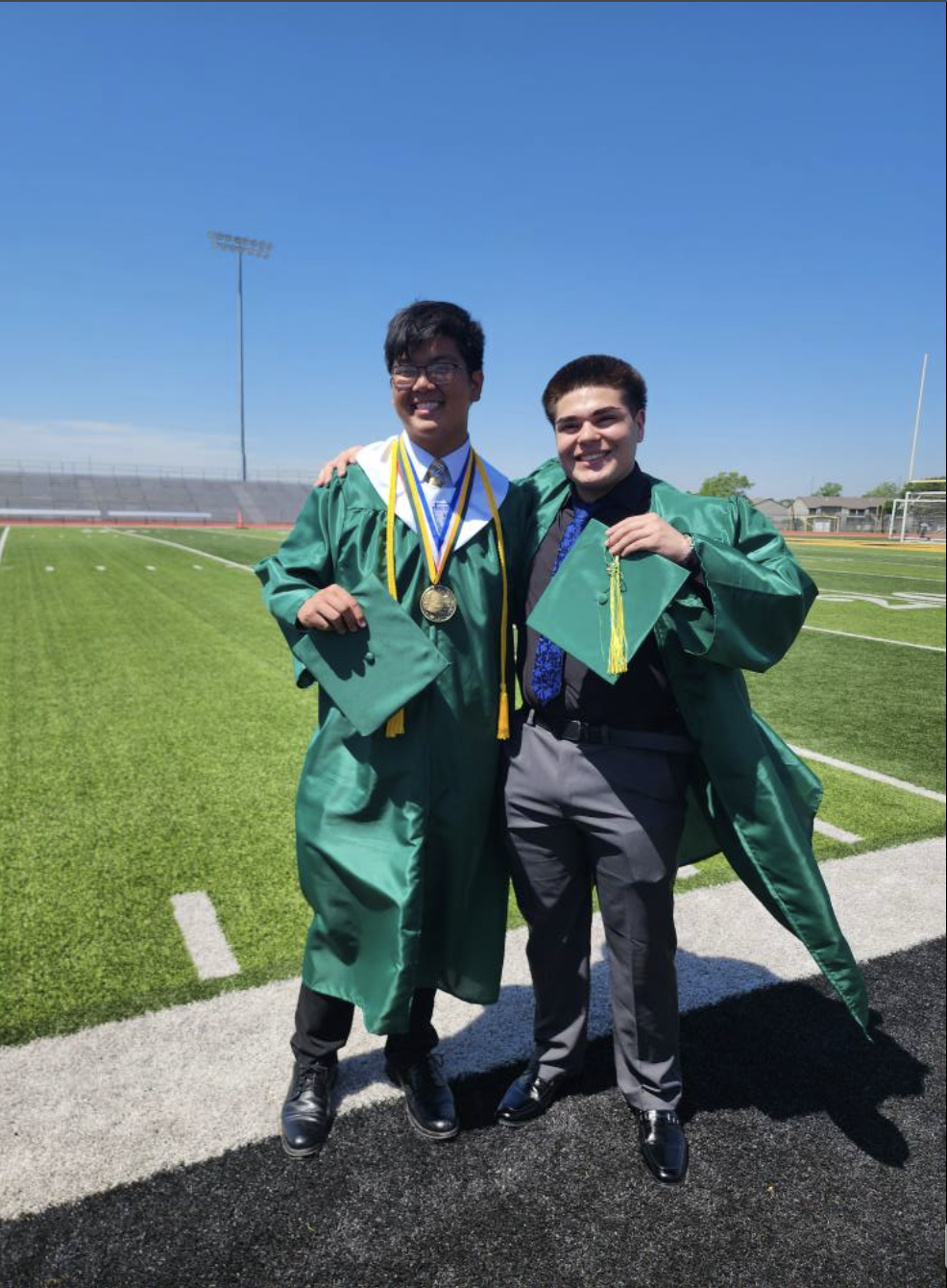 Austin Tran and his friend Hector are seen on their graduation day, dated May 15, 2025 | Source: Facebook/anntravels2