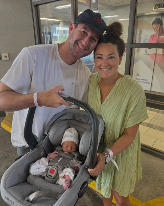 Connor Smith and Mattie Jackson posing with their newborn son, Wesley Alan Smith, while leaving the hospital in a post made on June 27, 2024 | Source: Facebook/Mattie Jackson Smith