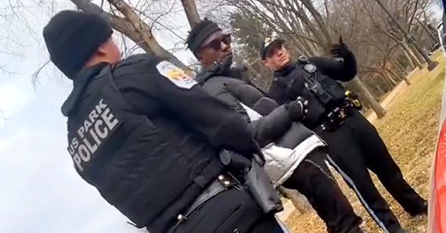 A black man and two white police officers talking in Washington D.C. | Source: Tiktok.com/jaythesaint9