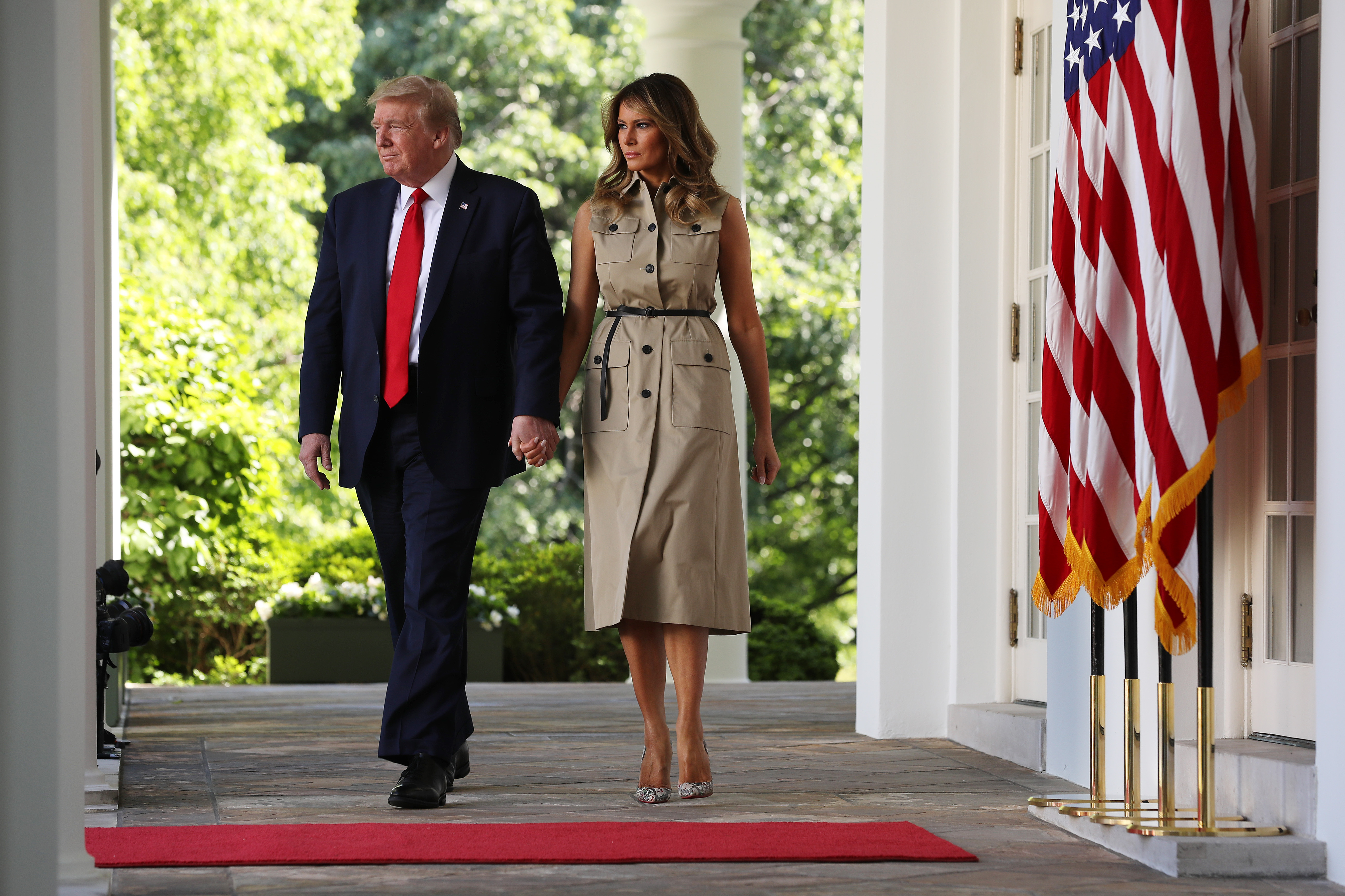 Donald and Melania Trump walk into the Rose Garden of the White House for a National Day of Prayer event May 7, 2020 in Washington, DC. | Source: Getty Images