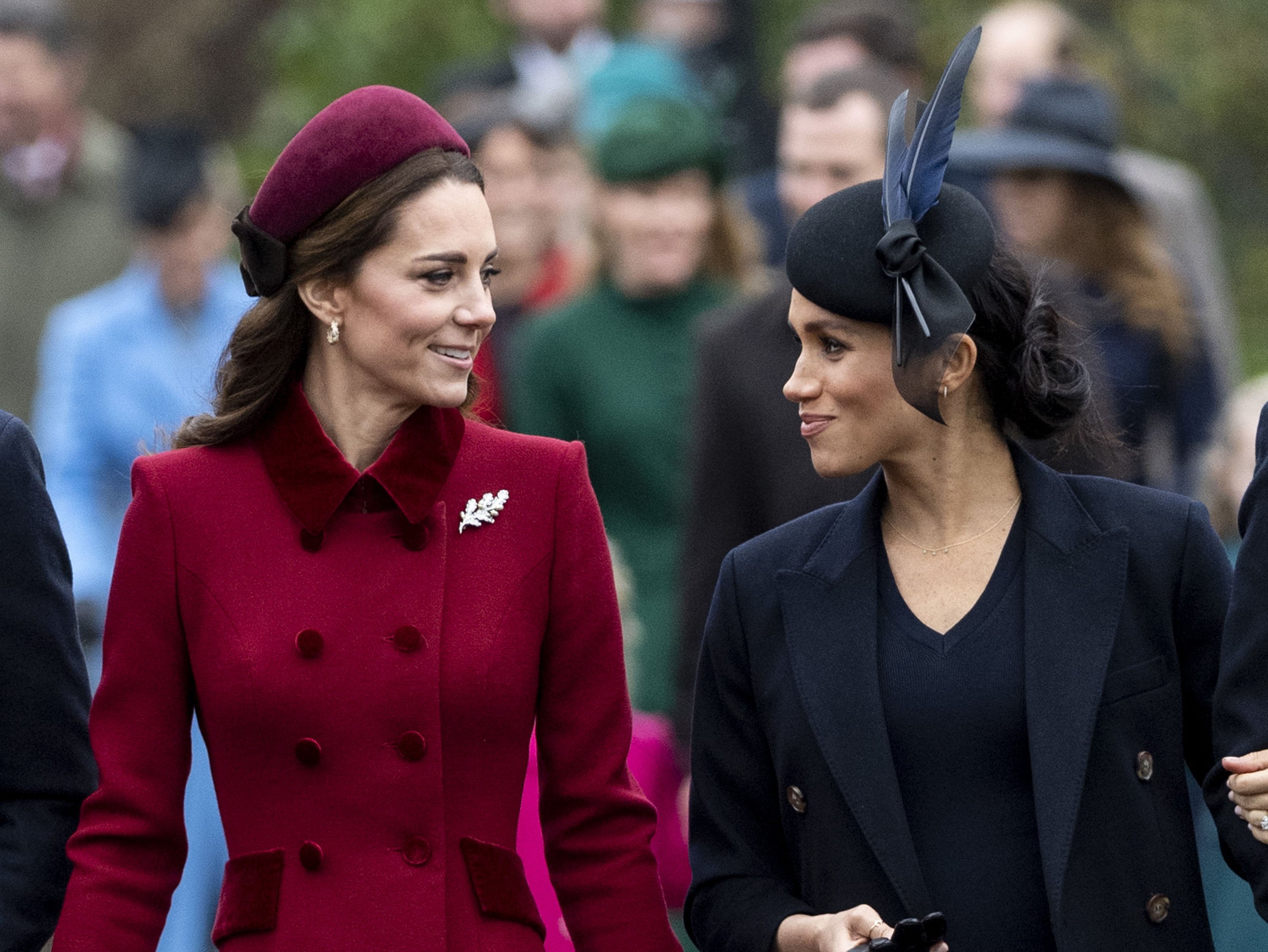 Kate Middleton, Duchess of Cambridge and Meghan Markle, Duchess of Sussex attending Christmas Day Church service at Church of St Mary Magdalene on the Sandringham estate on December 25, 2018 in King's Lynn, England. | Source: Getty Images