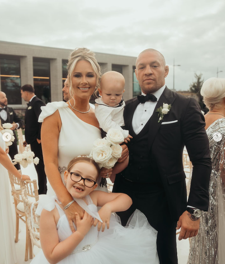 Dee Devlin and Conor McGregor with their kids, Croia and Mack, at Terry Kavanagh and Erin McGregors wedding on August 17, 2024 | Source: Instagram/thenotoriousmma