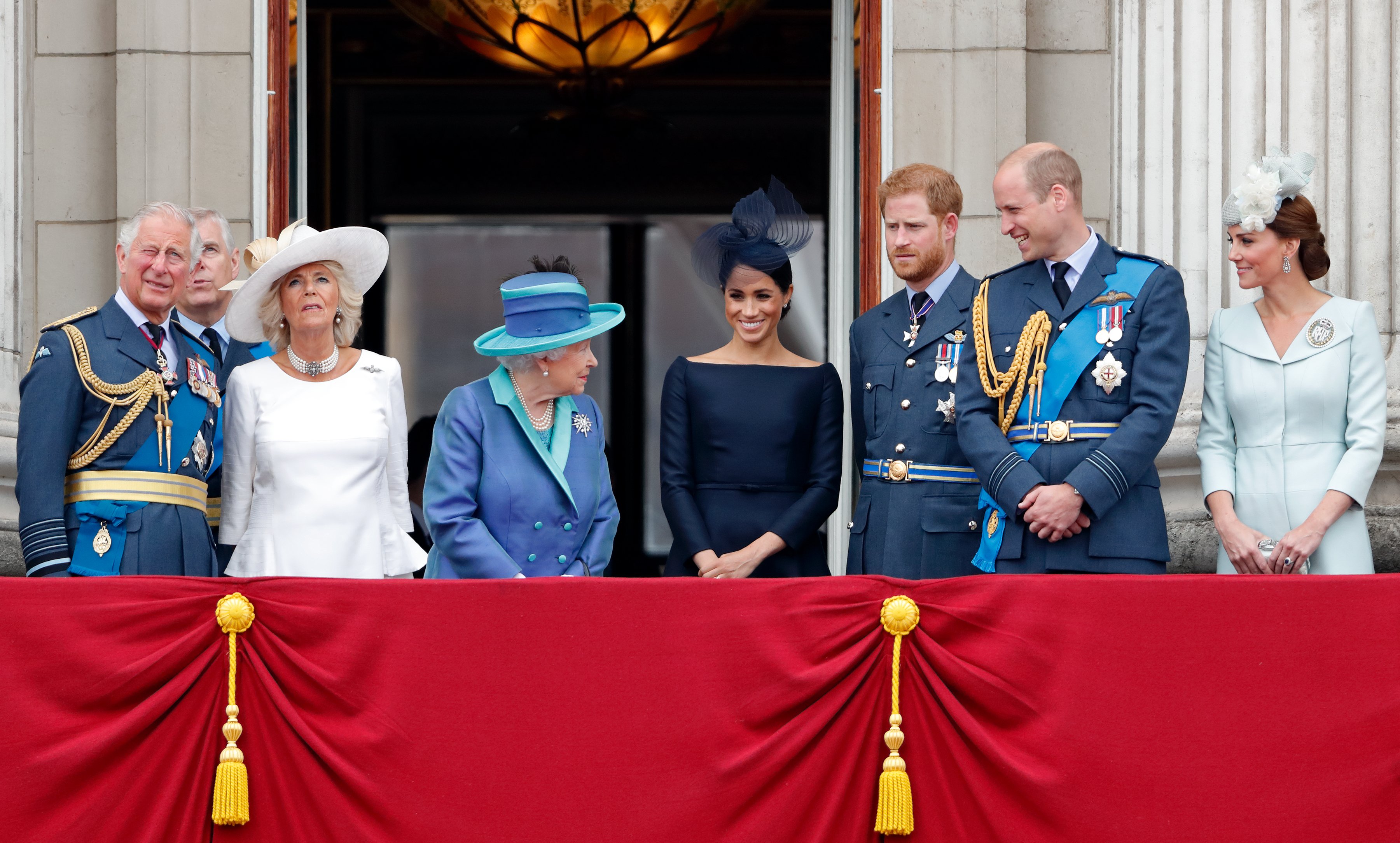 Prince Charles, Duchess Camilla, Queen Elizabeth II, Duchess Meghan, Prince Harry, Prince William and Duchess Kate attend a flypast to mark the centenary of the Royal Air Force on July 10, 2018 in London, UK. England.  |  Source: Getty Images