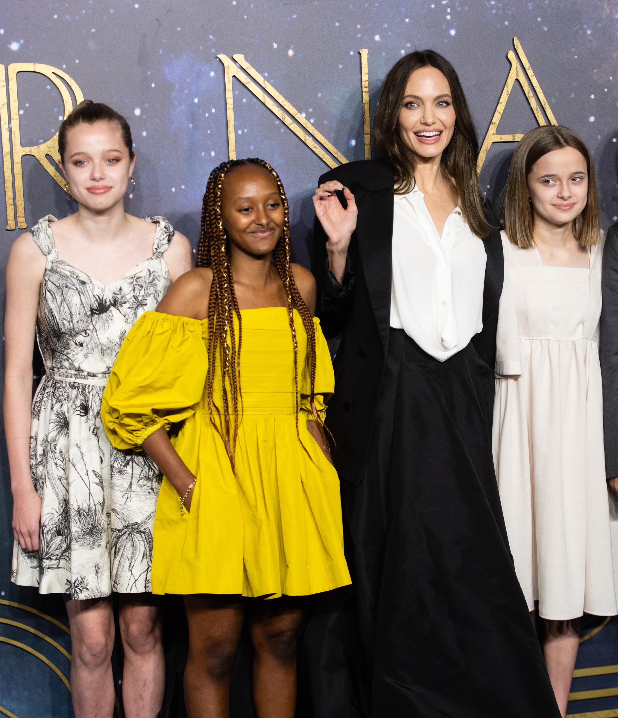 Angelina Jolie poses with daughters Zahara, Shiloh, and Vivienne during the premiere of Eternals. The actress said watching her daughters grow into young women has helped her reconnect with parts of herself she thought she had lost. | Source: Getty Images