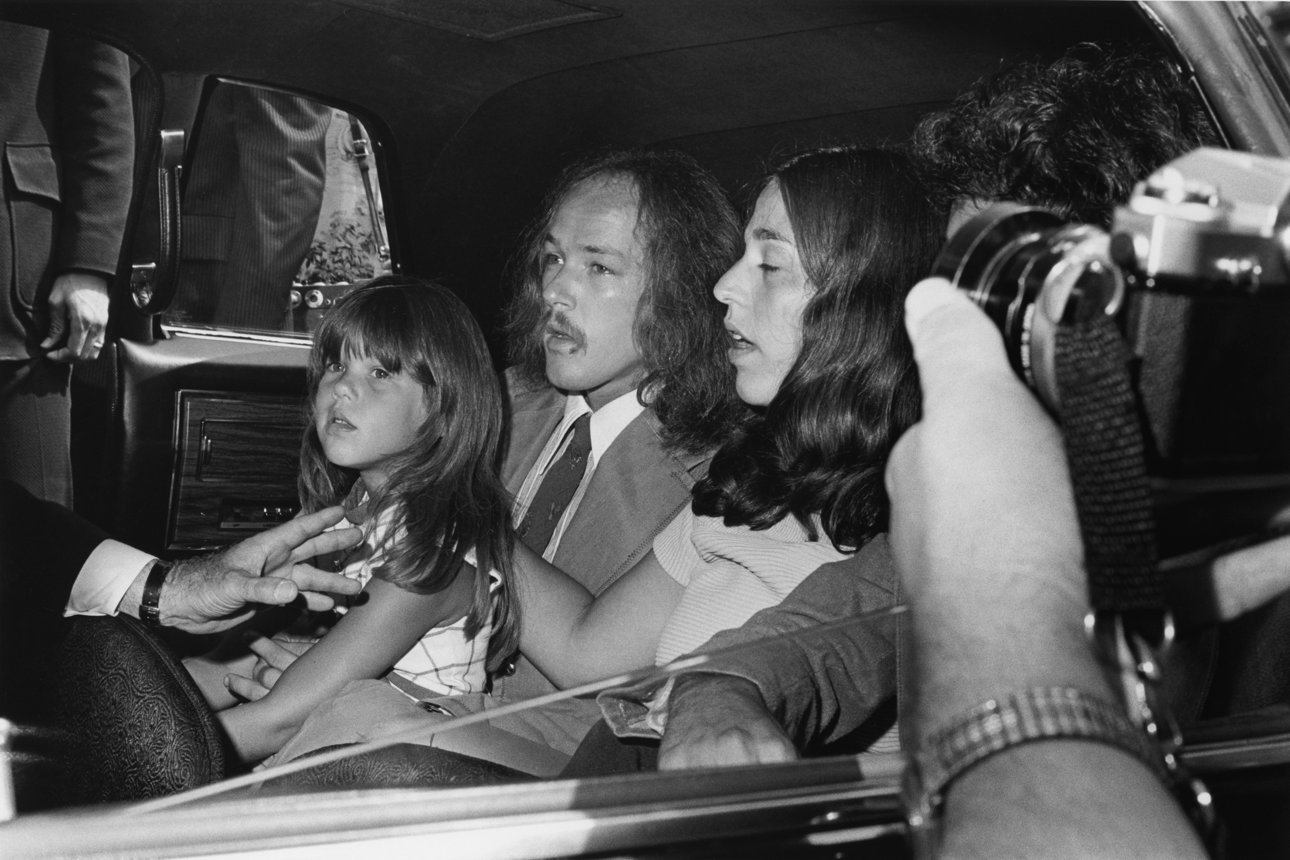 Russ Kunkel, Owen Elliot (C), and Leah Kunkel attend the funeral for singer Cass Elliot of The Mamas And The Papas at Groman Mortuary on August 2, 1974, in Los Angeles, California. | Source: Getty Images