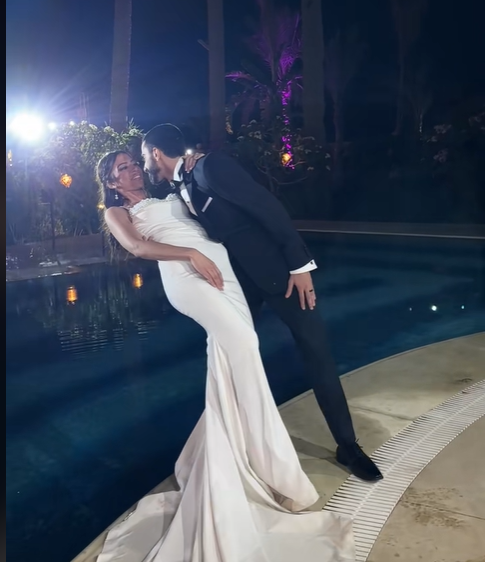 The bride smiling at something her groom said before the viral moment, from a July 2025 video post | Source: TikTok/emadjoe1