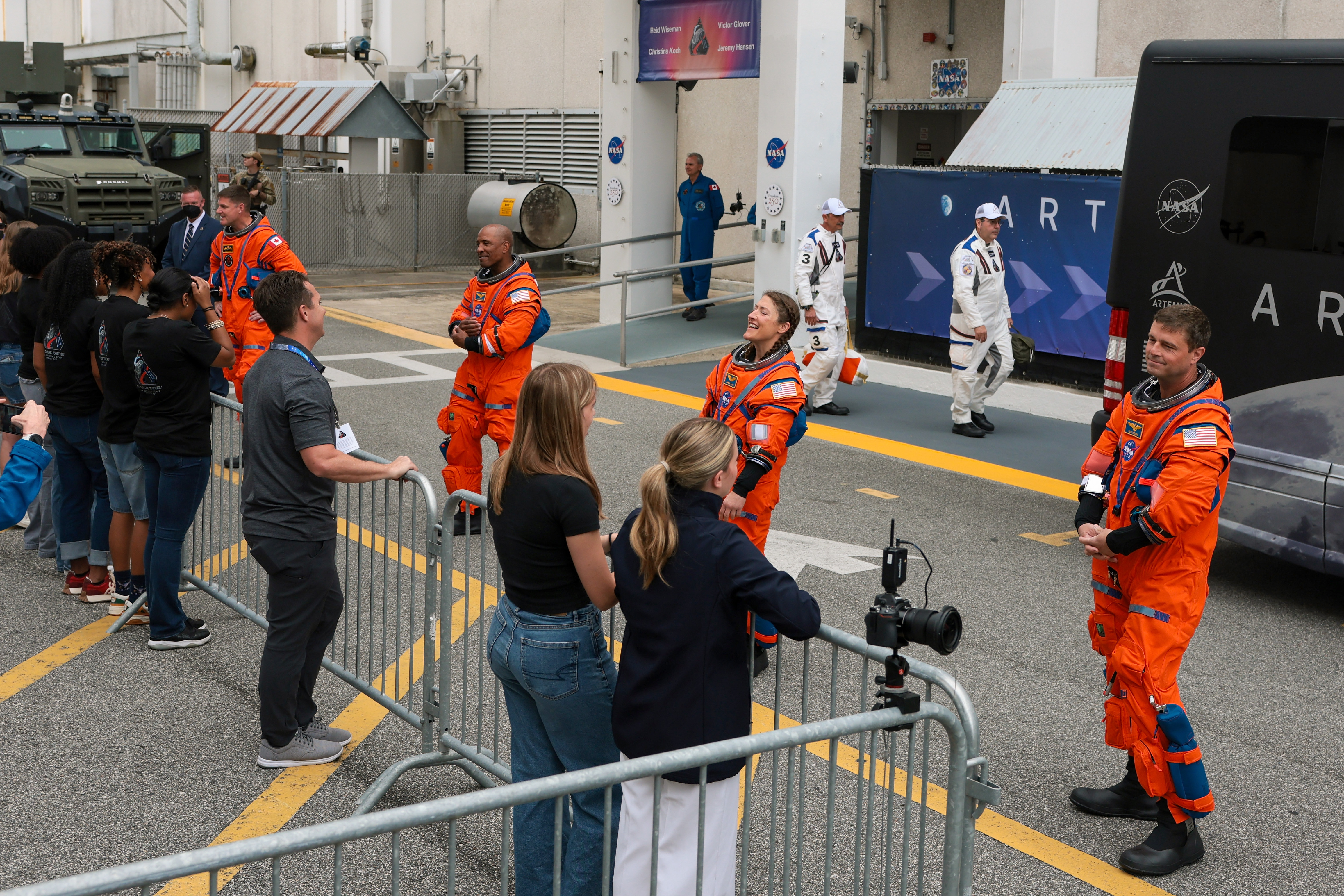 Mission specialist Jeremy Hansen of CSA, pilot Victor Glover, mission specialist Christina Koch and commander Reid Wiseman speak to their family members as they depart the Neil A. Armstrong Operations and Checkout Building on April 01, 2026 in Cape Canaveral, Florida | Source: Getty Images
