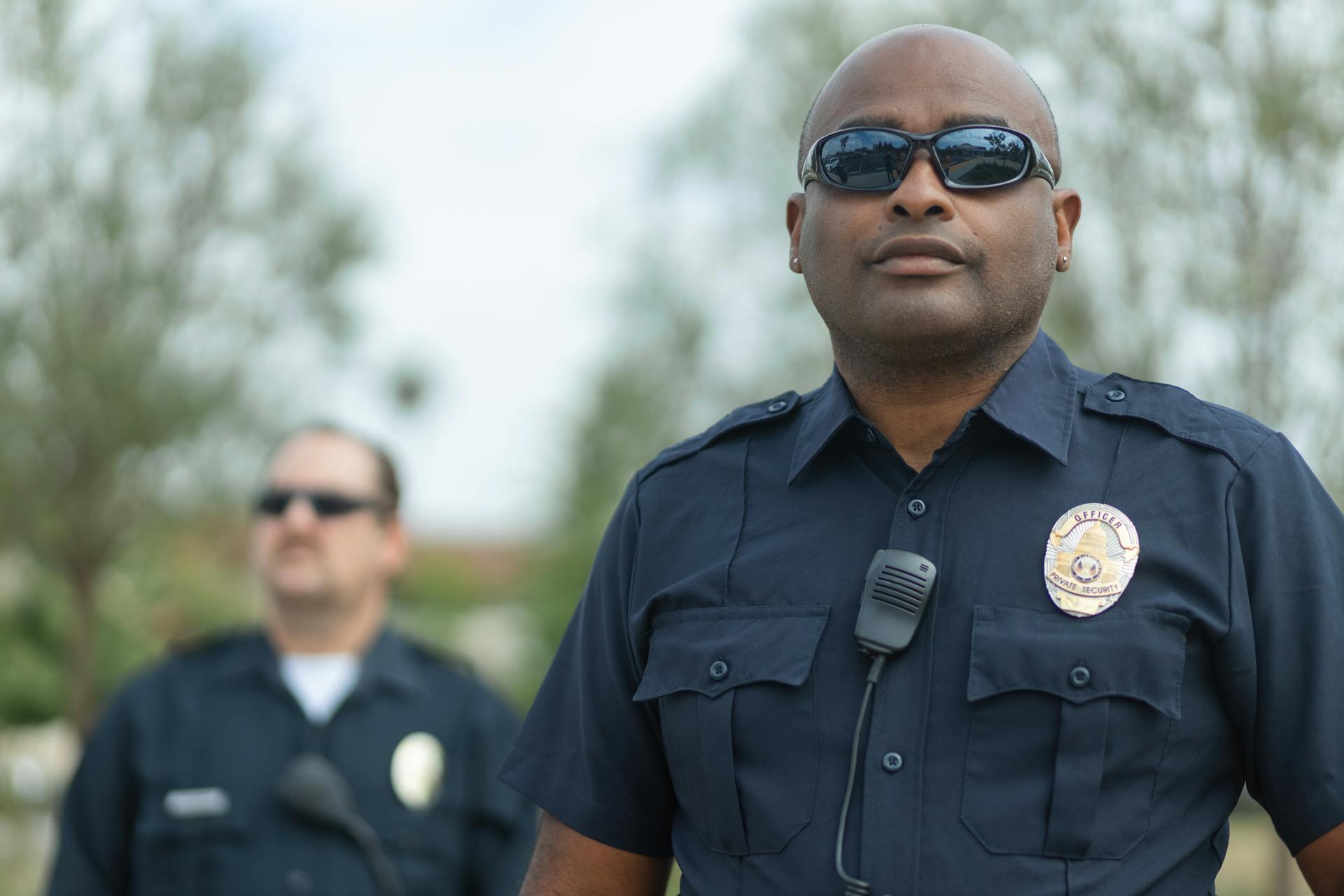 Two police officers outside a house | Source: Pexels