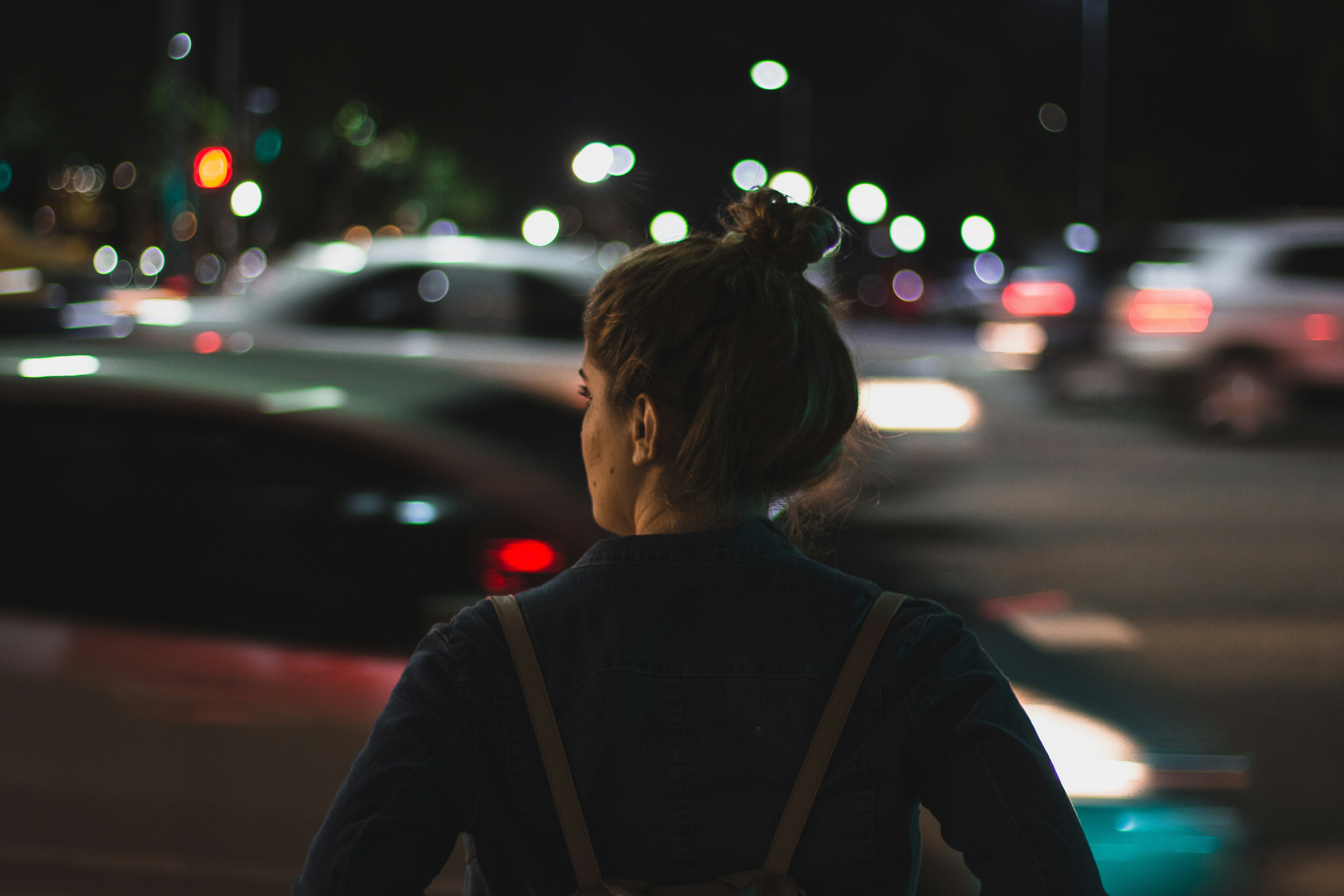 Woman in night street | Source: Unsplash