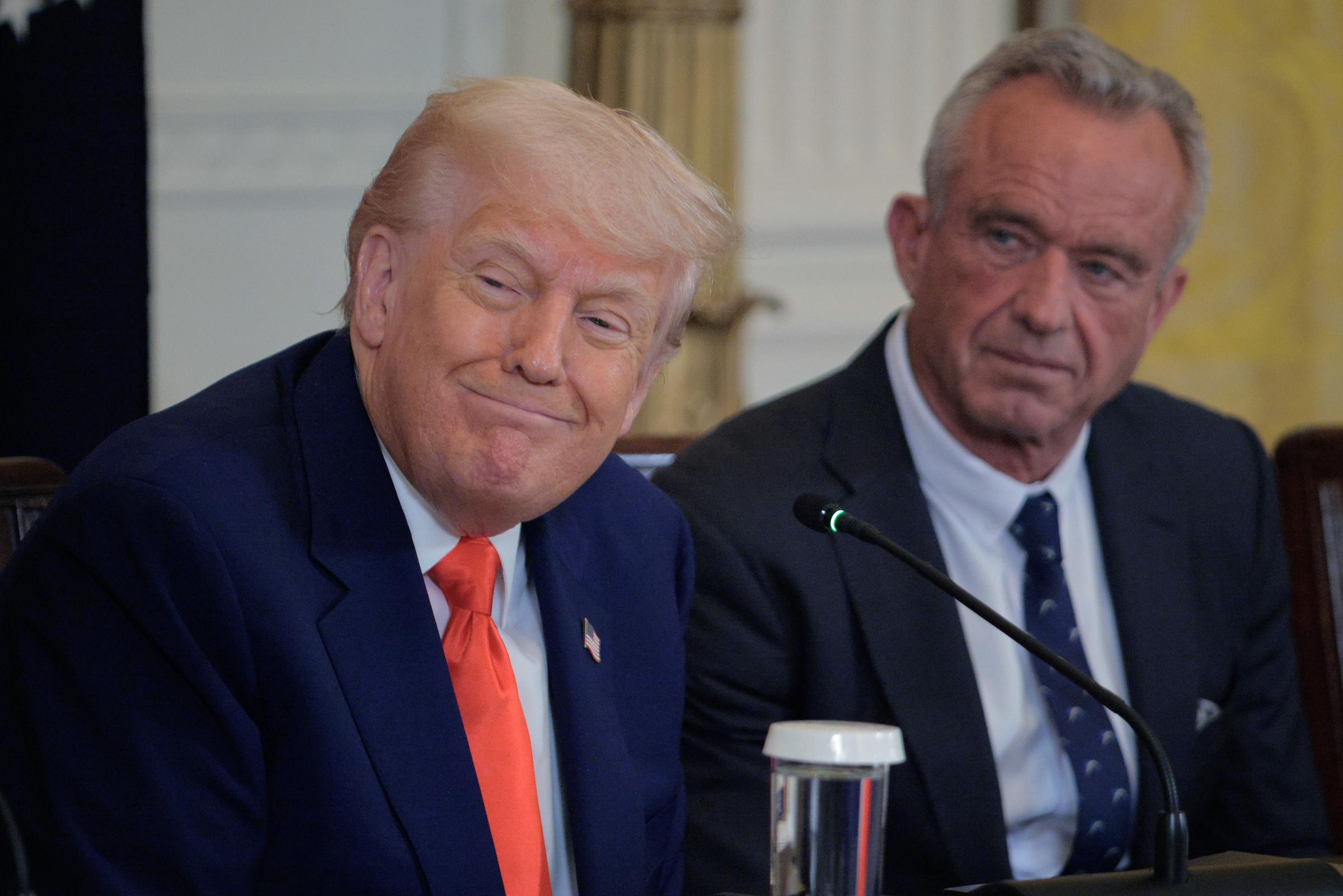 Donald Trump and Robert F. Kennedy Jr. attend an event introducing a new Make America Healthy Again Commission report in the East Room of the White House on May 22, 2025 in Washington, DC | Source: Getty Images