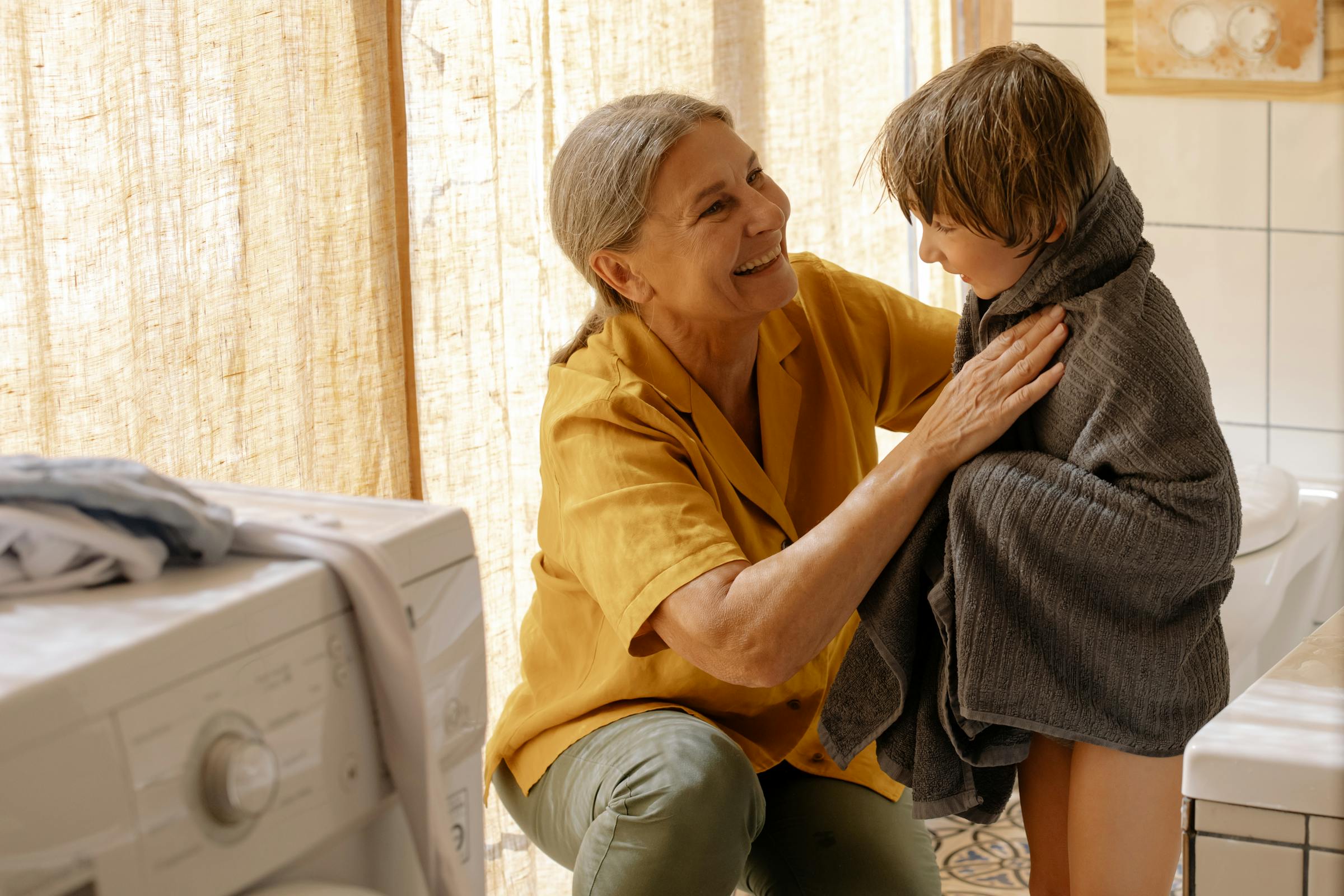 A grandmother drying her grandson | Source: Pexels