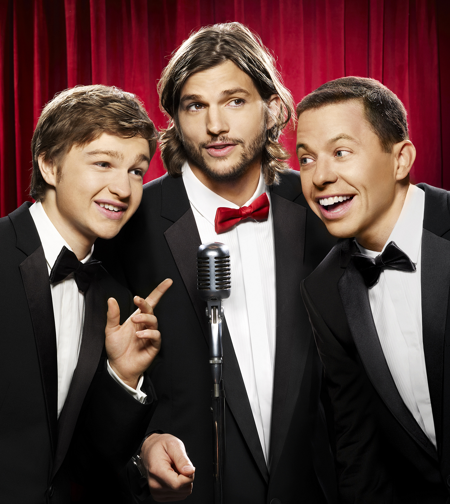Angus T. Jones, Ashton Kutcher and Jon Cryer on "Two and a Half Men," in 2011 | Source: Getty Images