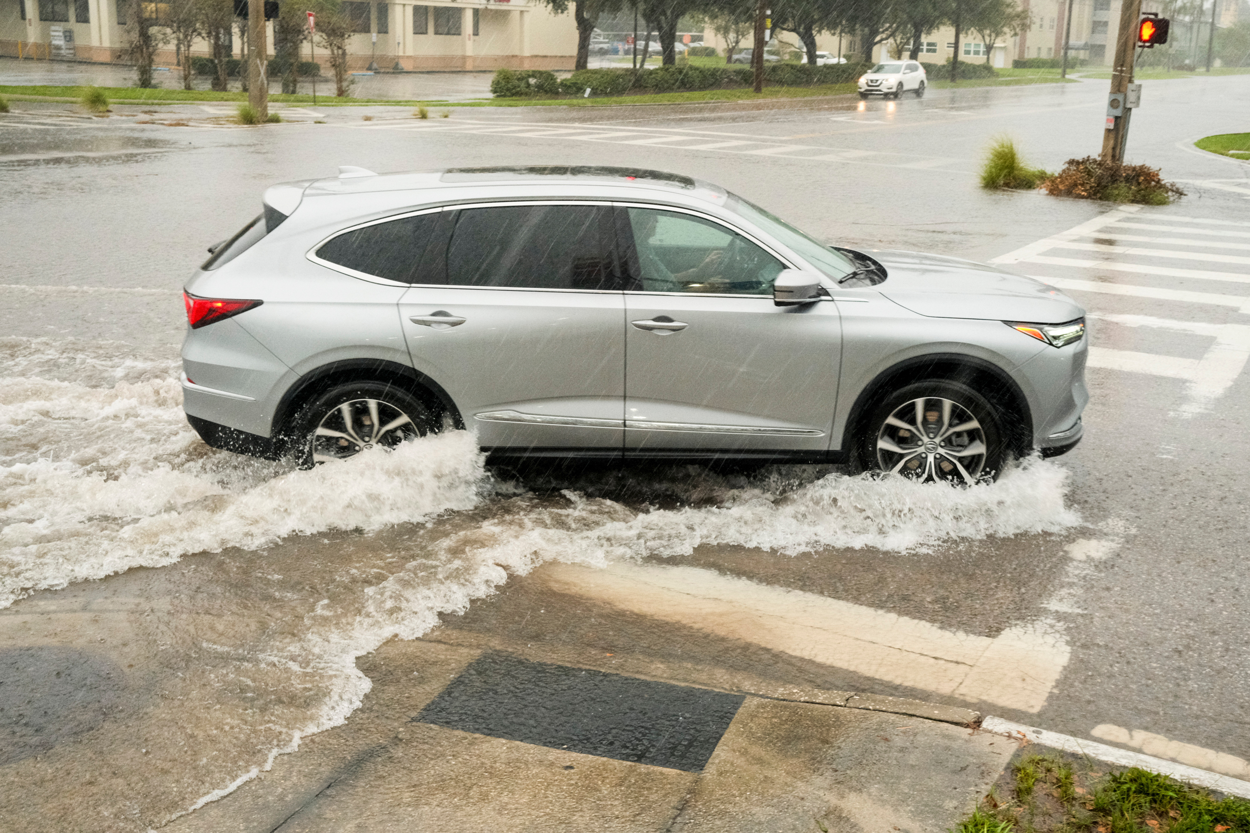 A vehicle sits at a flooding intersection on October 9, 2024 in St. Petersburg, Florida | Source: Getty Images