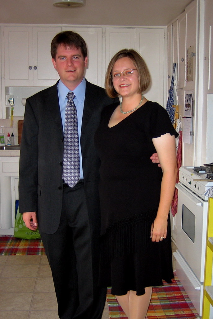 A woman in a black dress with a man | Source: flickr.com/chris_radcliff