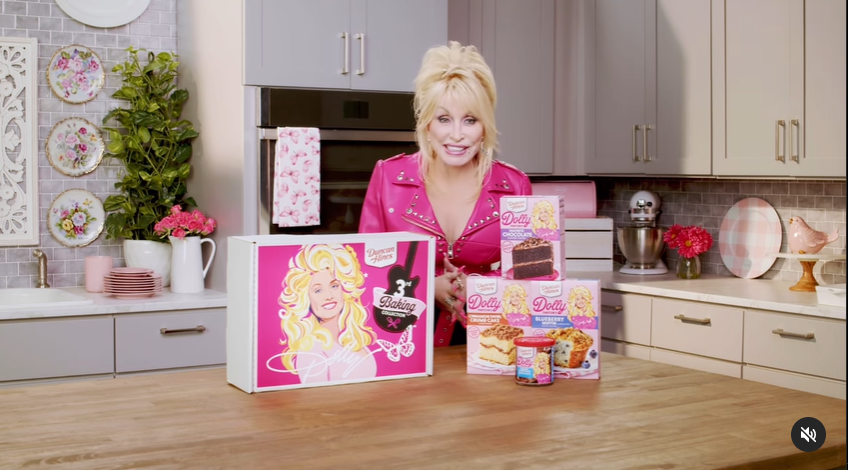 A screenshot of Dolly Parton showcasing her range of pancake mix products.  | Source: Instagram/dollyparton