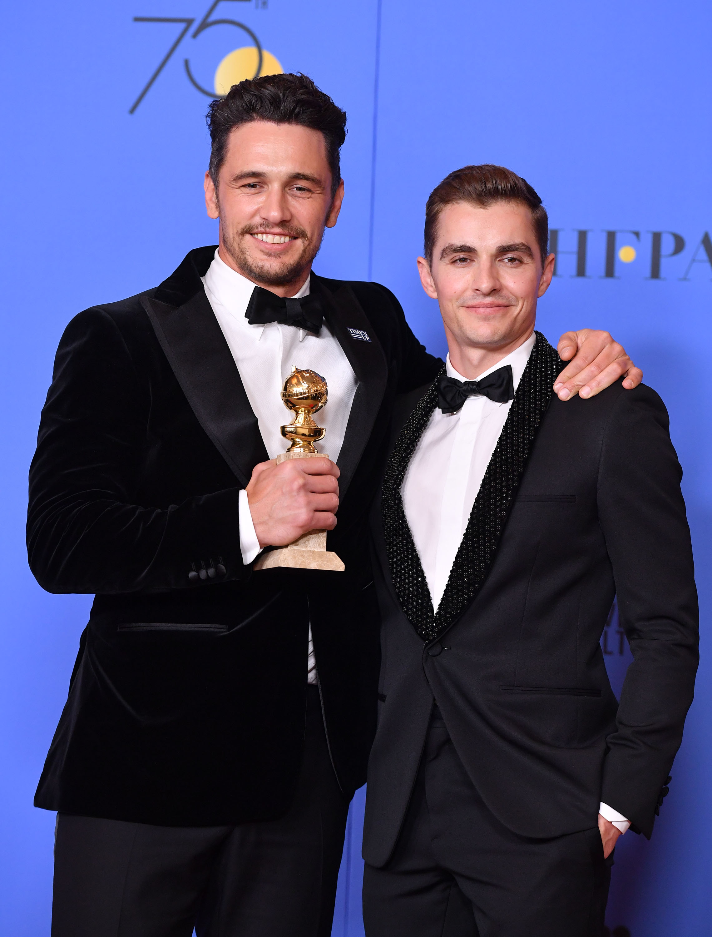 James Franco celebrates his Golden Globe win for "The Disaster Artist," posing with brother Dave Franco. The award recognized his performance as Tommy Wiseau in the cult biopic.
