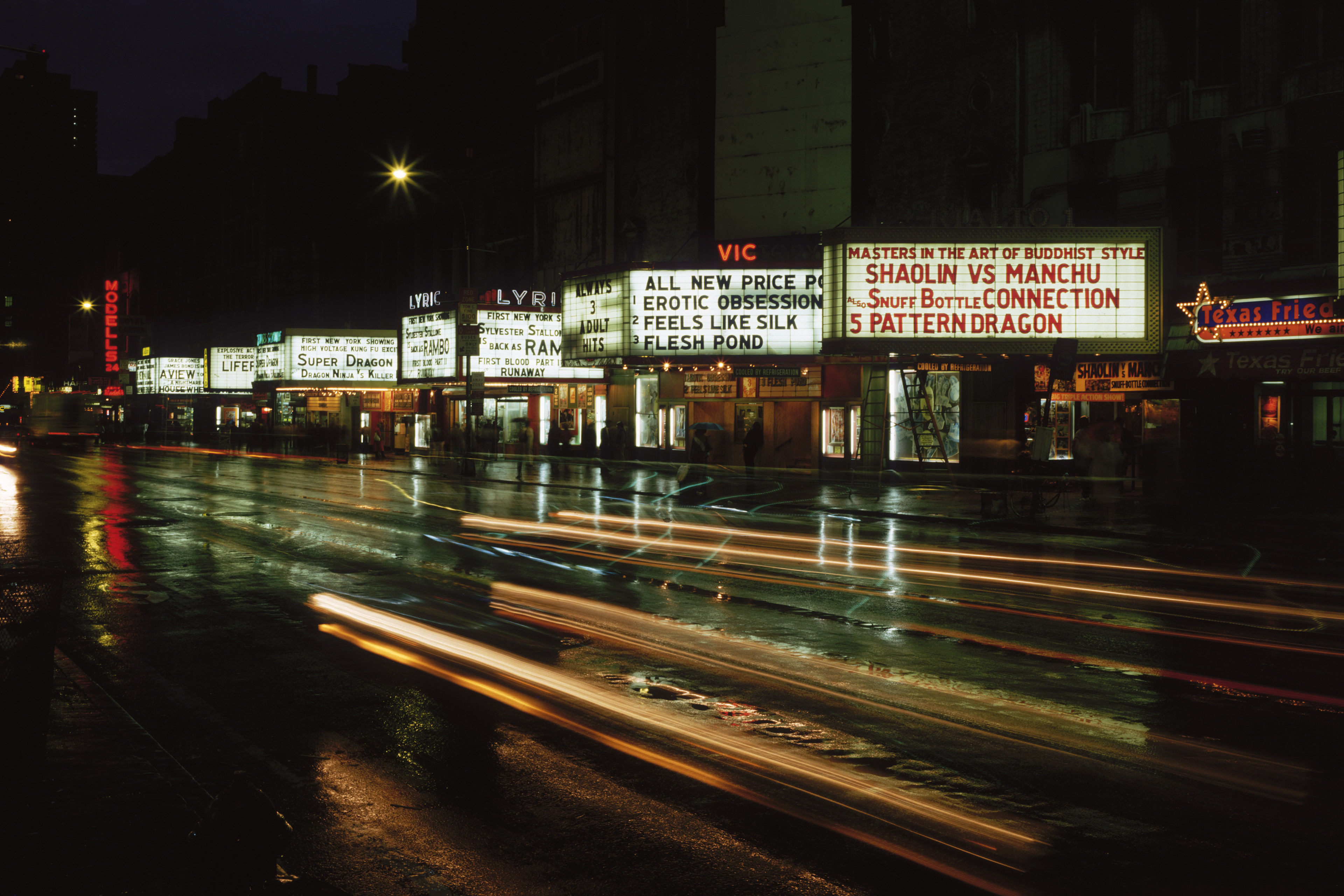 Cinema signs advertising adult and martial arts films on 42nd Street, New York, circa 1977. | Source: Getty Images