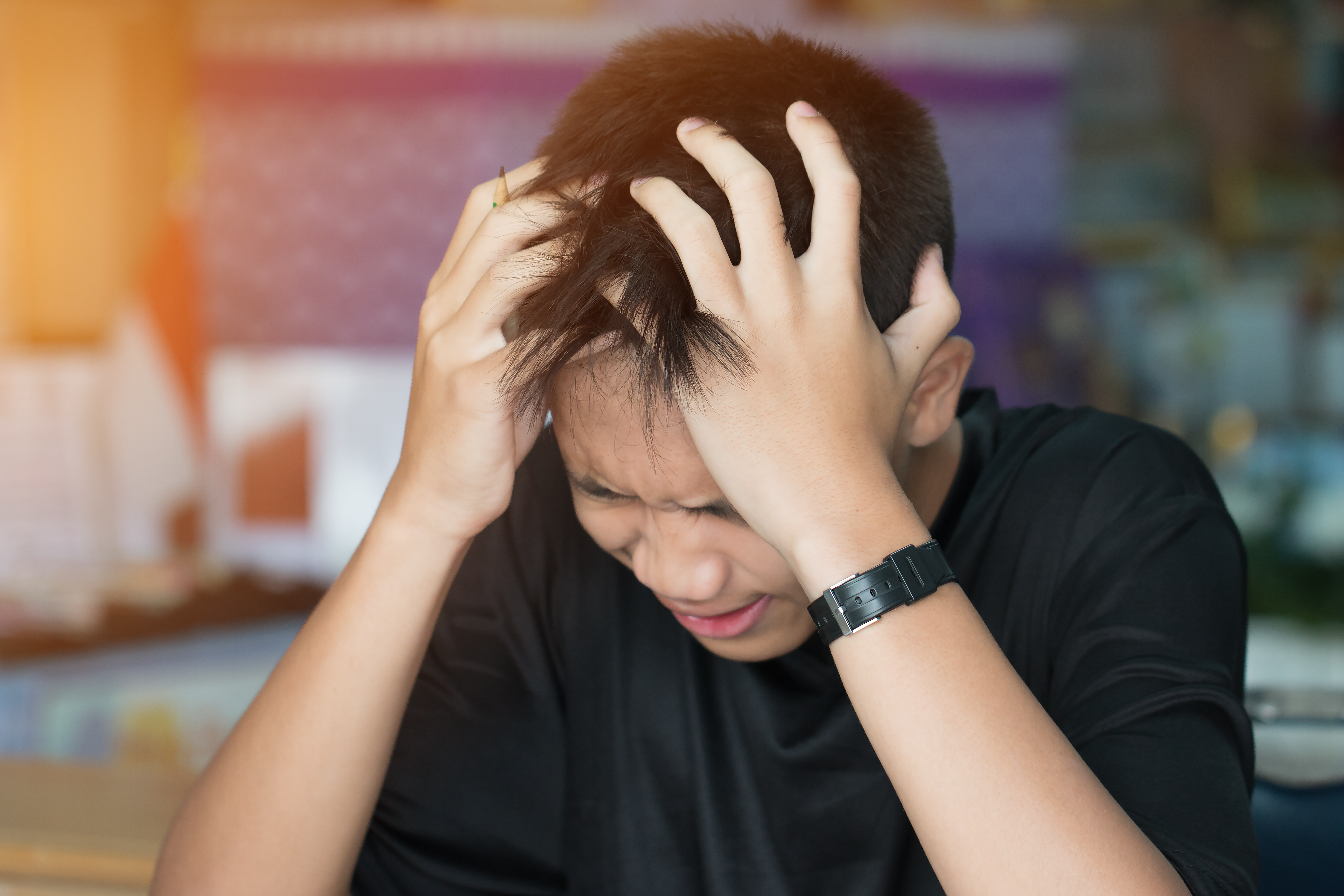 A stressed young boy | Source: Shutterstock