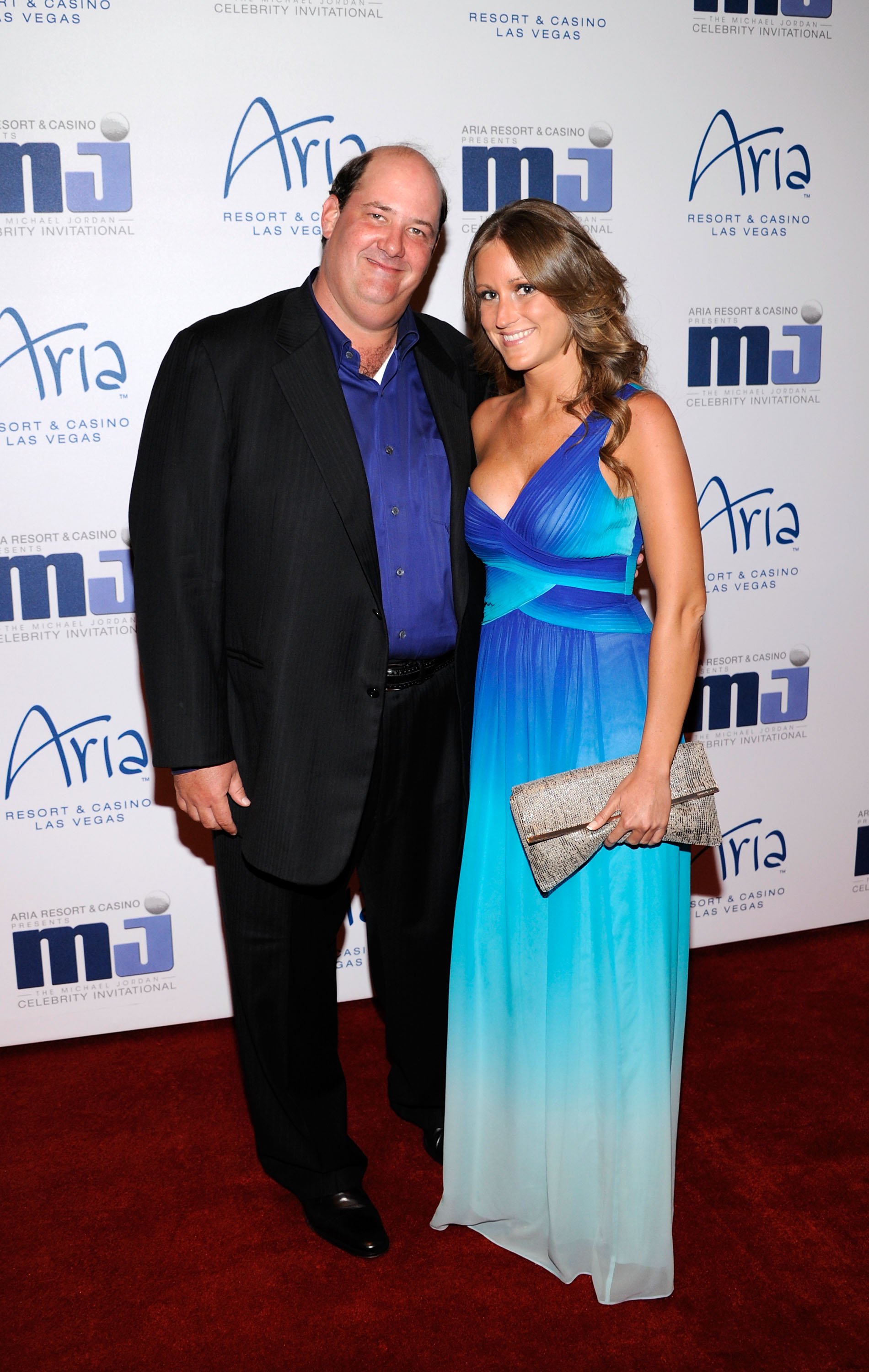 Brian Baumgartner and Celeste Ackelson arrive at the 11th annual Michael Jordan Celebrity Invitational gala at the Aria Resort & Casino at CityCenter March 30, 2011 in Las Vegas, Nevada | Photo: Getty Images
