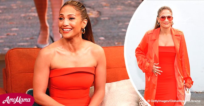 Jennifer Lopez dazzles in a neon coral outfit, diverting attention from her $4,995 purse