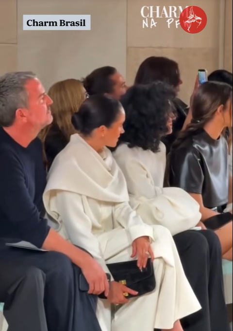 Meghan Markle and other attendees watch something, from a video post dated October 7, 2025 | Source: TikTok/TheStandard
