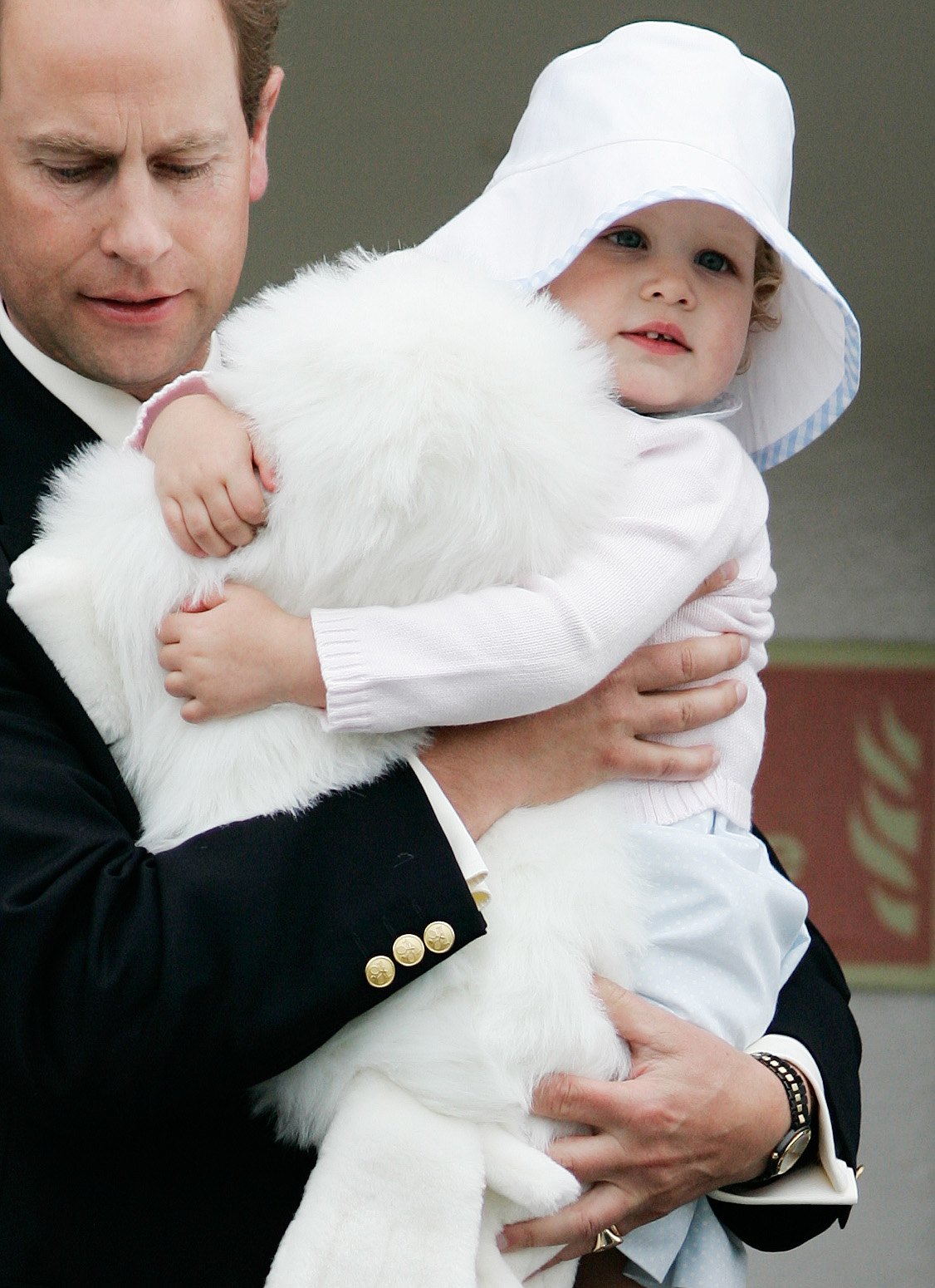 On July 29, 2006, Edward, Earl of Wessex, was photographed holding his daughter during an outing in Stornoway, Scotland. The young royal's early years were spent enjoying simple family moments away from the public eye. | Source: Getty Images