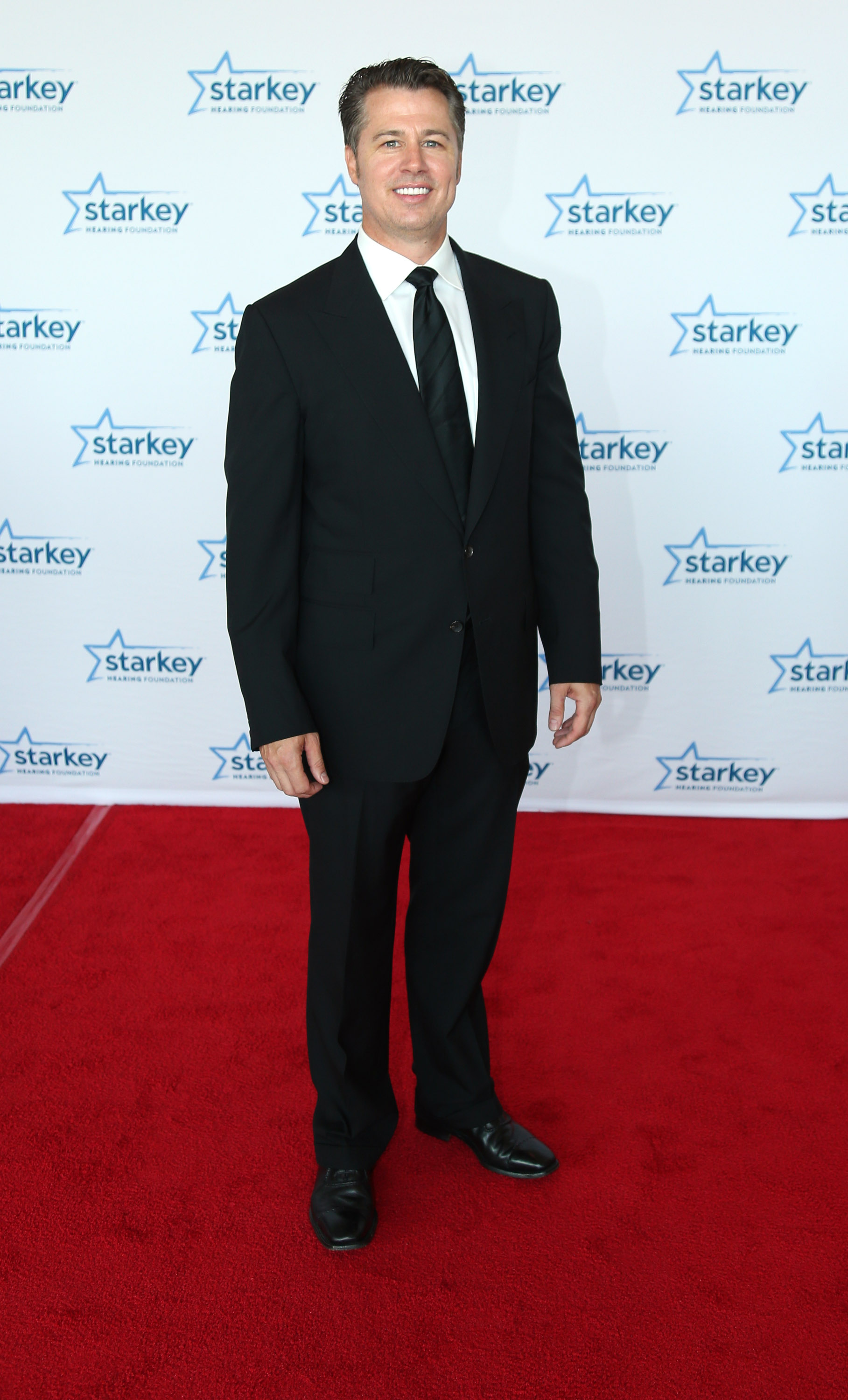Doug Pitt graces the red carpet during the 2014 Starkey Hearing Foundation So The World May Hear Awards Gala, which took place at the St. Paul River Centre in Minnesota on July 20, 2014 | Source: Getty Images