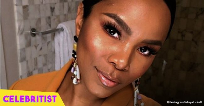 Letoya Luckett exudes pregnancy glow in pink dress, showing off her growing baby bump