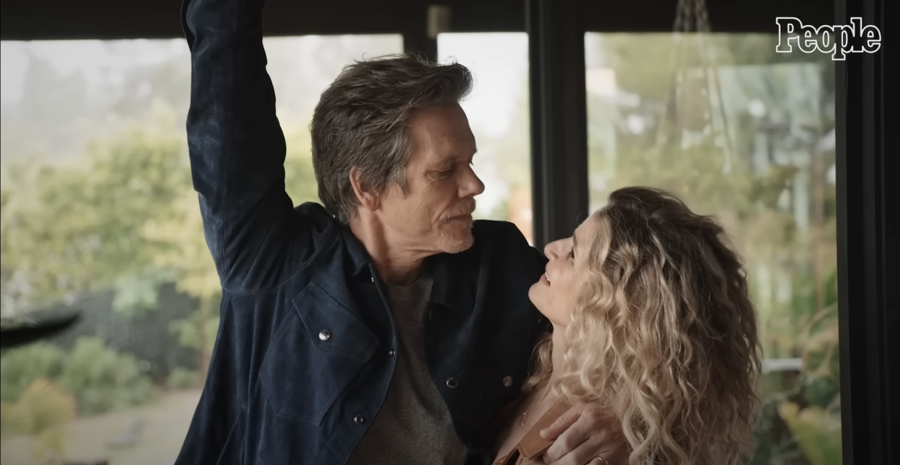 Kevin Bacon posing with his wife Kyra Sedgwick | Source: YouTube/@People