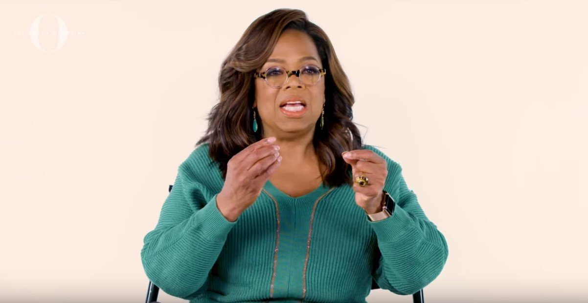 Oprah Winfrey answering questions on what she did with her first million dollars and how she splurged on fluffy towels | Photo: YouTube/O, The Oprah Magazine