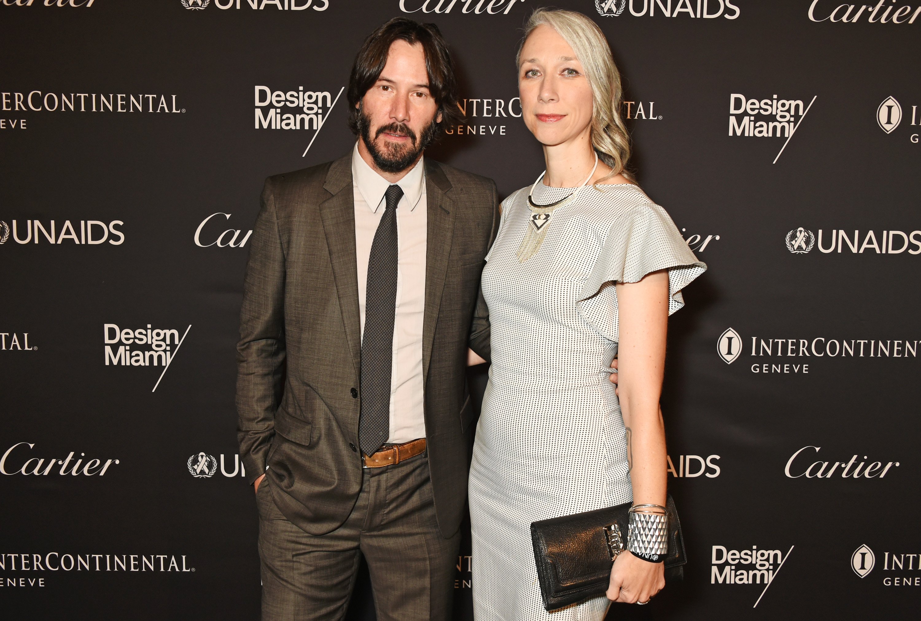 Keanu Reeves (L) and artist Alexandra Grant attend the UNAIDS Gala during Art Basel 2016 at Design Miami/ Basel on June 13, 2016, in Basel, Switzerland. | Source: Getty Images.