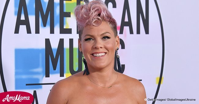 Pink shows off gorgeous cleavage in zip up black jumpsuit during recent outing with daughter