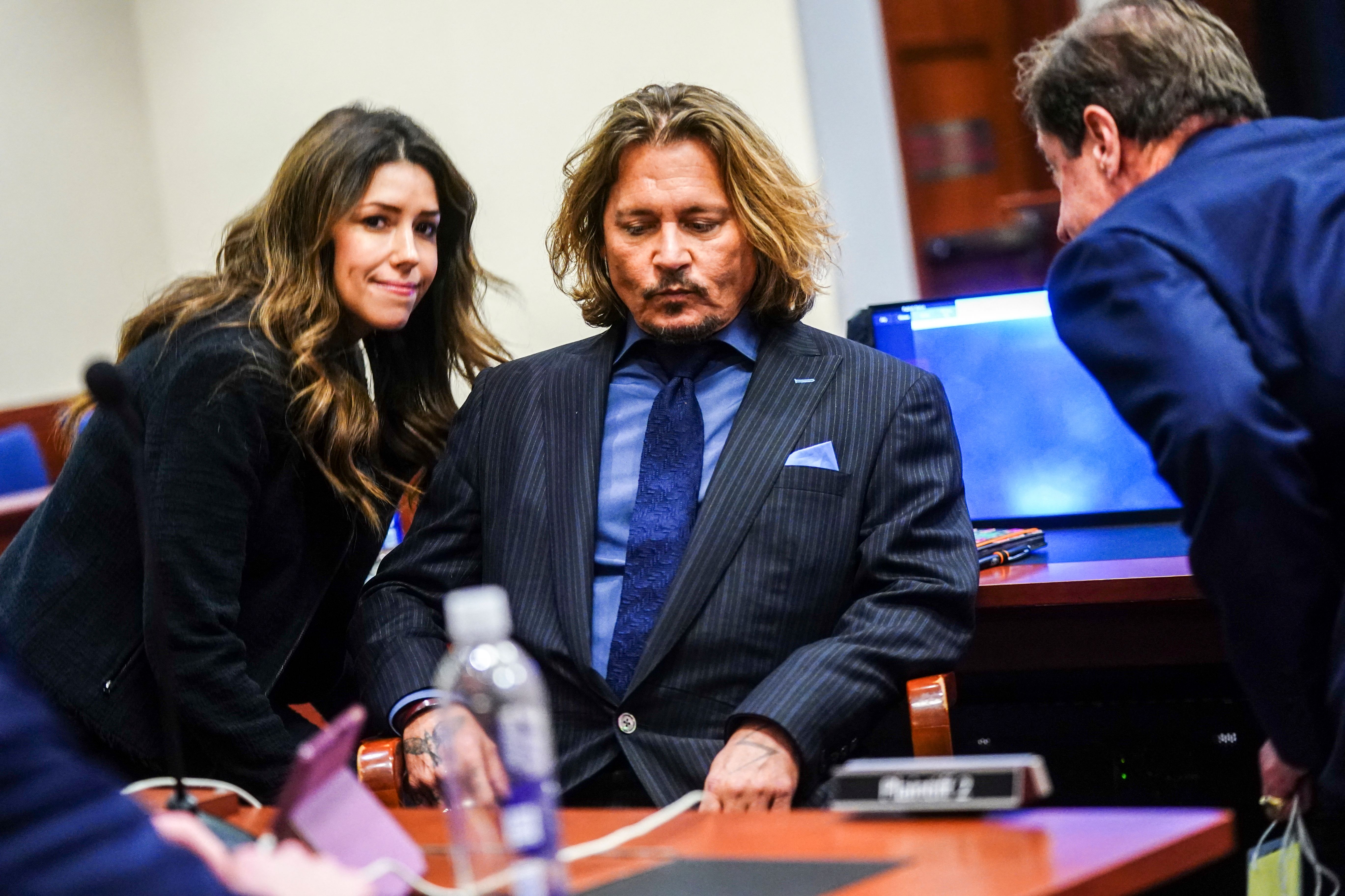 Johnny Depp listens to his legal team during the $50 million Depp vs Heard defamation trial at the Fairfax County Circuit Court in Fairfax, Virginia, on April 14, 2022. | Source: Getty Images