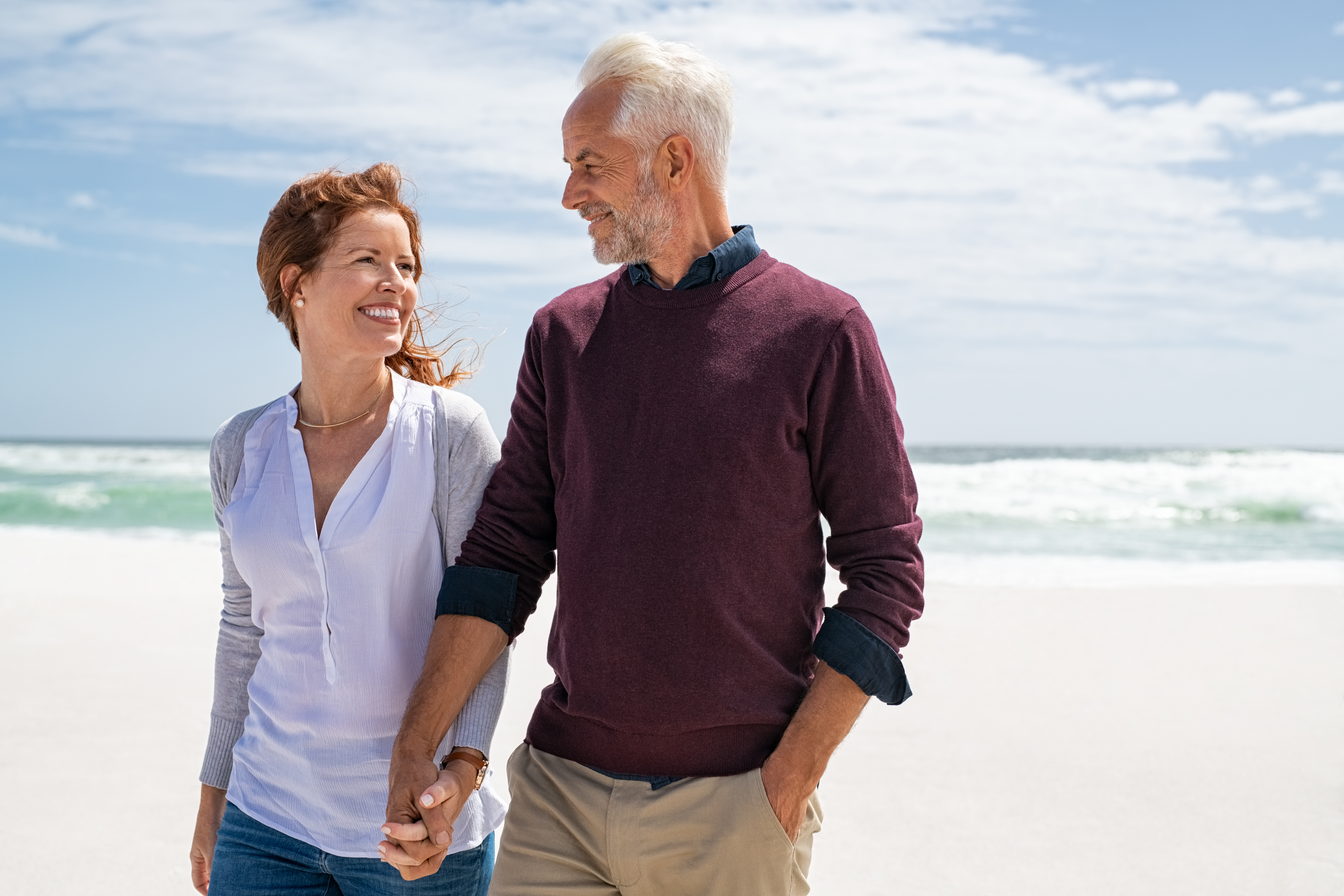 A happy couple at the beach | Source: Shutterstock