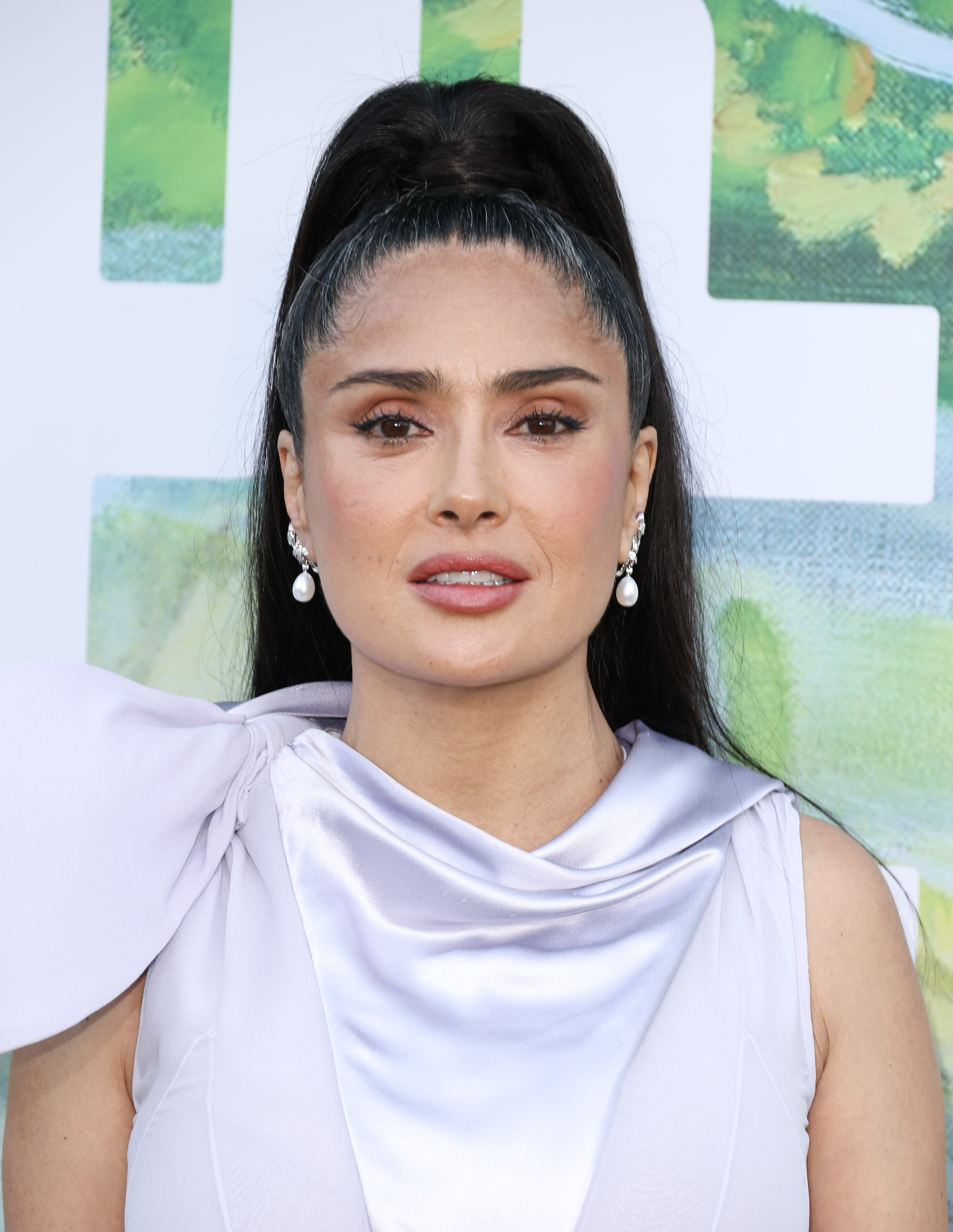 This 2026 close-up arrived as online commenters questioned Hayek's styling, face, and overall presentation. It helped turn a fashionable outing into a broader discussion about beauty expectations for women in Hollywood.
