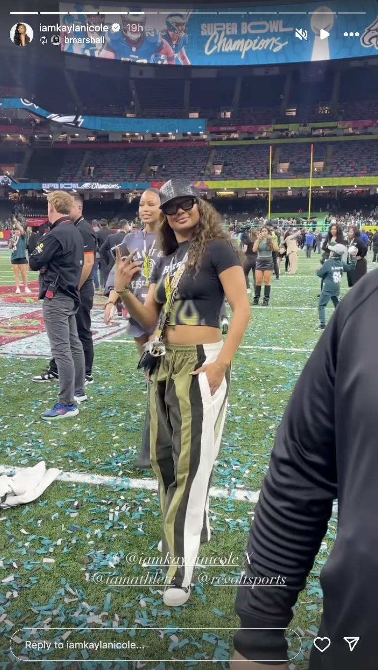 Kayla Nicole smiles as she poses on the football field | Source: Instagram/iamkaylanicole