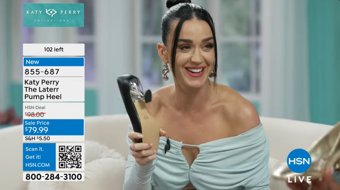 Katy Perry laughs while holding a shoe as she talks about Daisy Dove Bloom's insistence on being called by her full name, according to an HSNtv interview on May 10, 2024 | Source: YouTube/hsntv