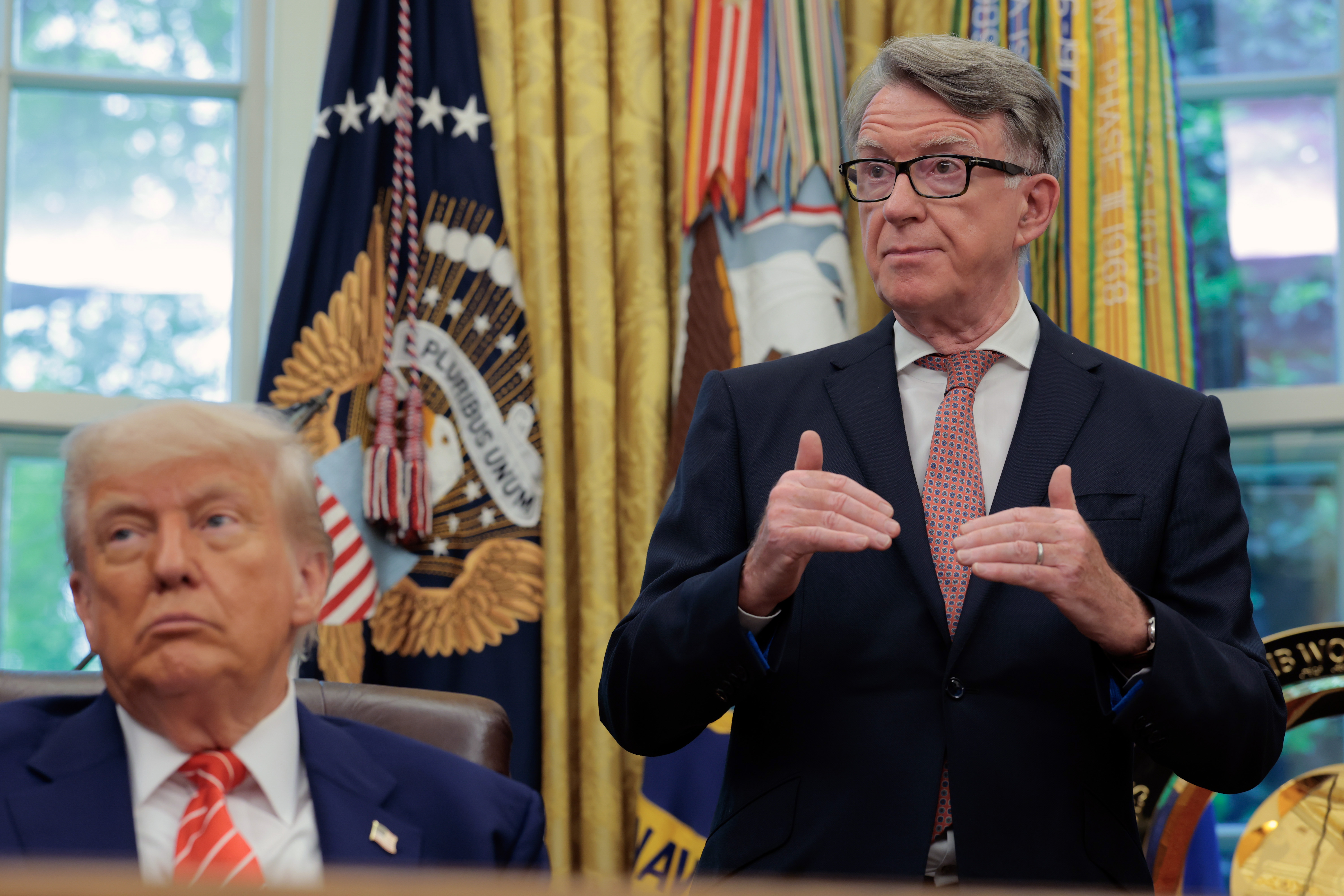 U.S. President Donald Trump alongside Lord Peter Mandelson in the Oval Office at the White House on May 8, 2025, in Washington, D.C., United States. | Source: Getty Images