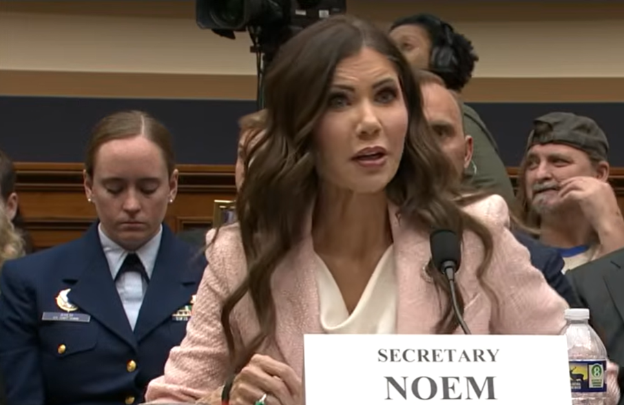 Kristi Noem testifies before lawmakers during a congressional hearing, speaking into a microphone.  | Source: YouTube/C-SPAN