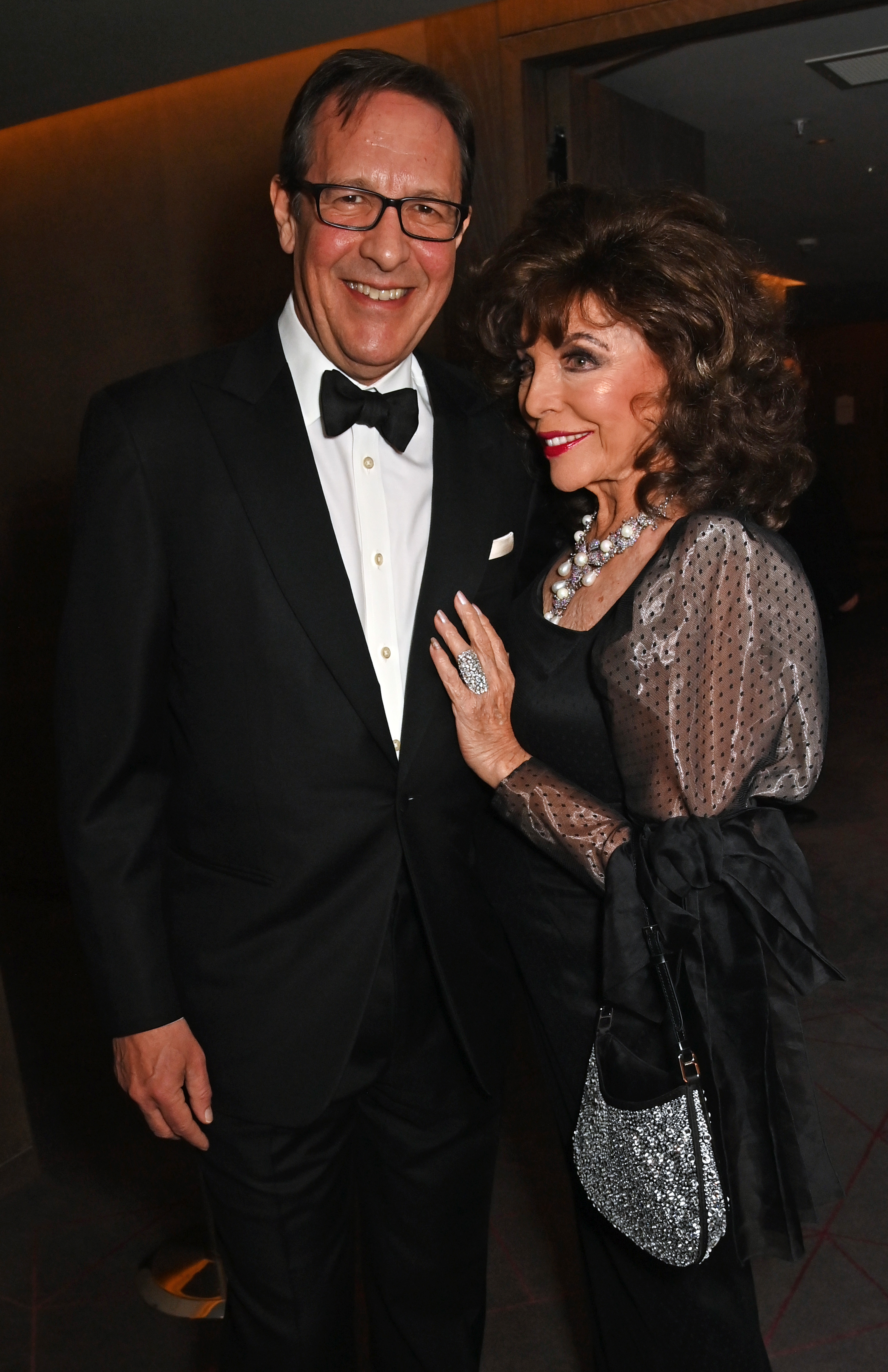 Percy Gibson and Dame Joan Collins at The Variety Club Showbusiness Awards in London, England, on April 28, 2024. | Source: Getty Images