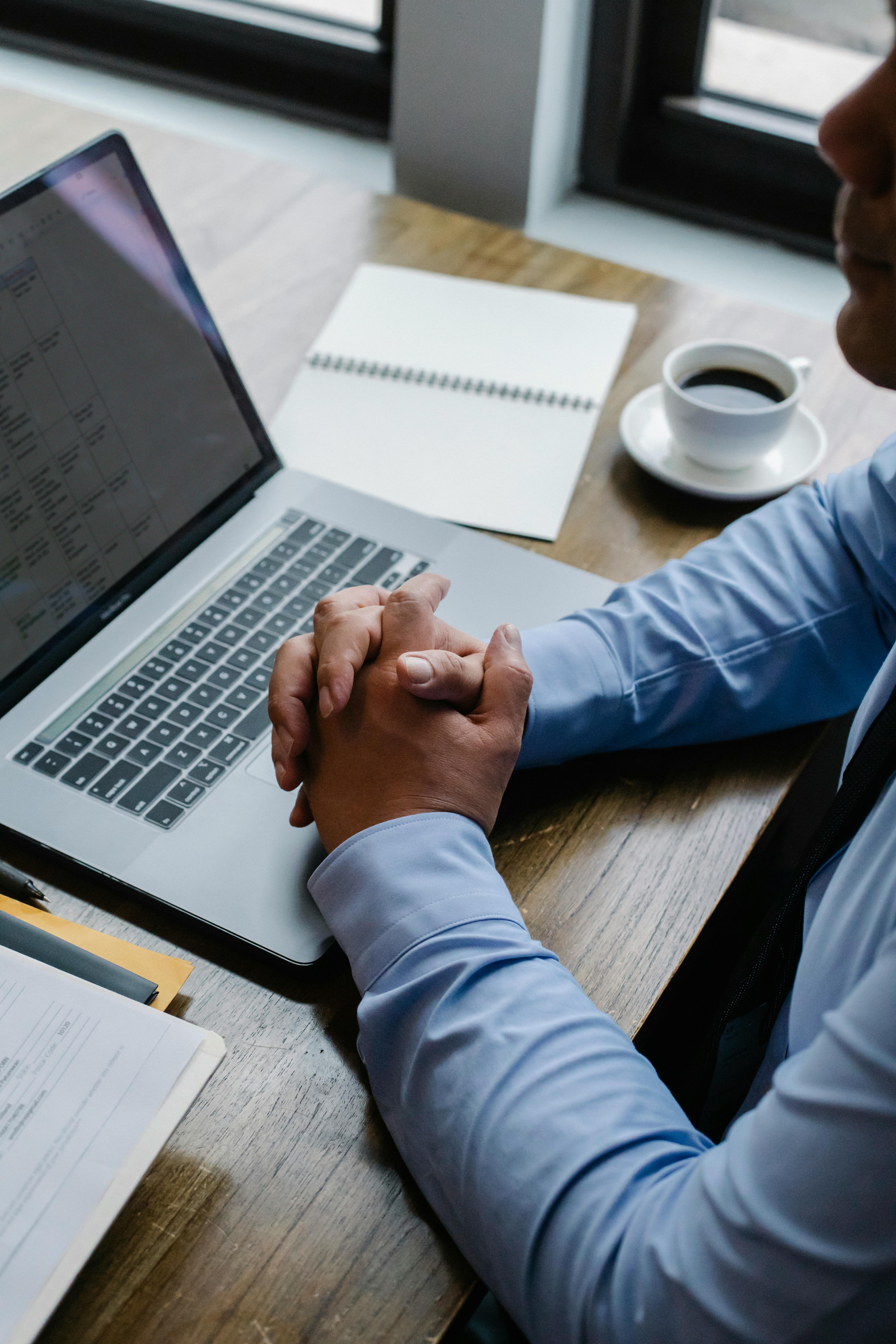 A manager looking at his laptop | Source: Pexels