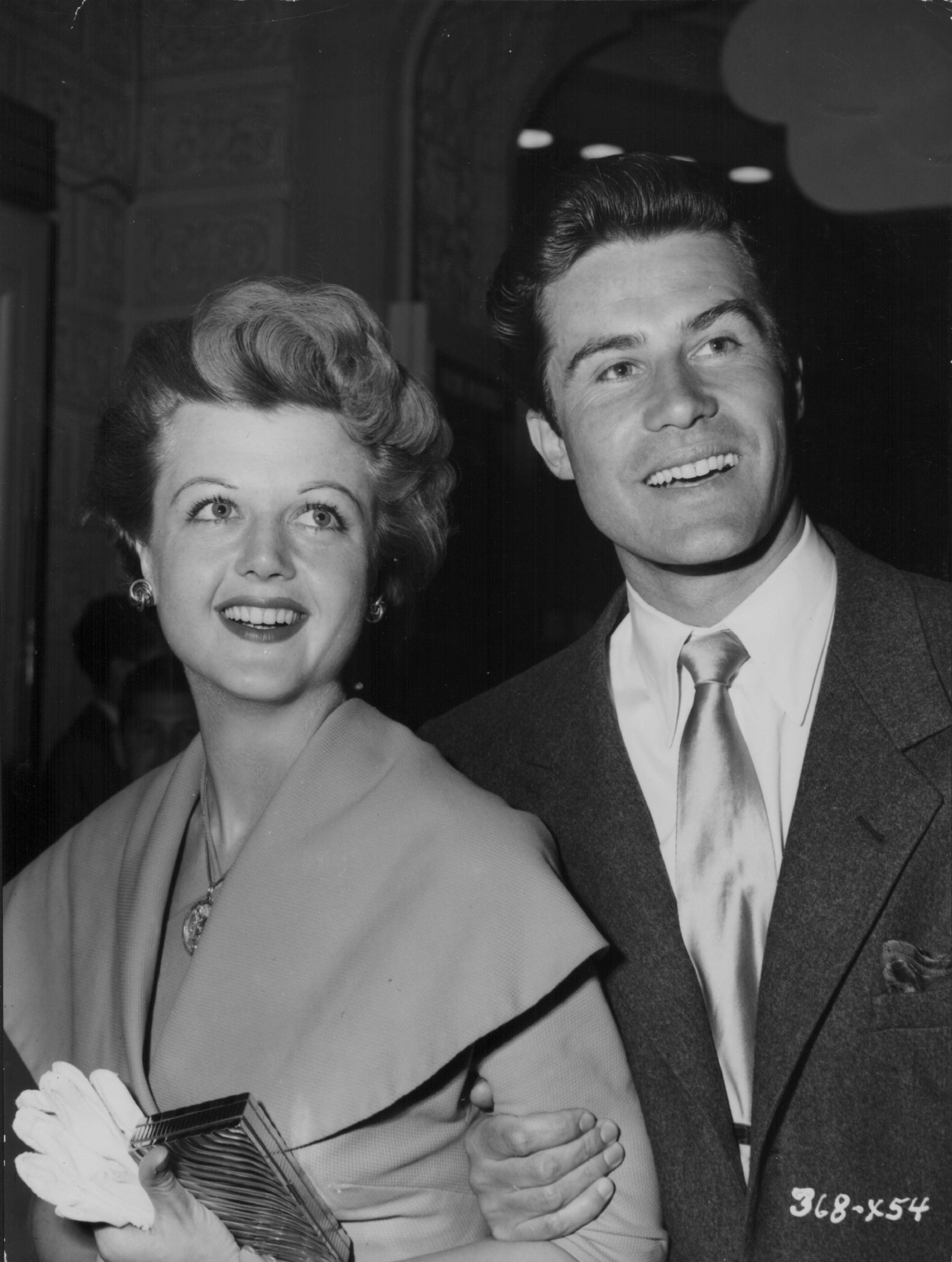 Actress Angela Lansbury and her husband Peter Shaw attending the premiere of the movie 'The Glass Menagerie', 1950. | Source: Getty Images